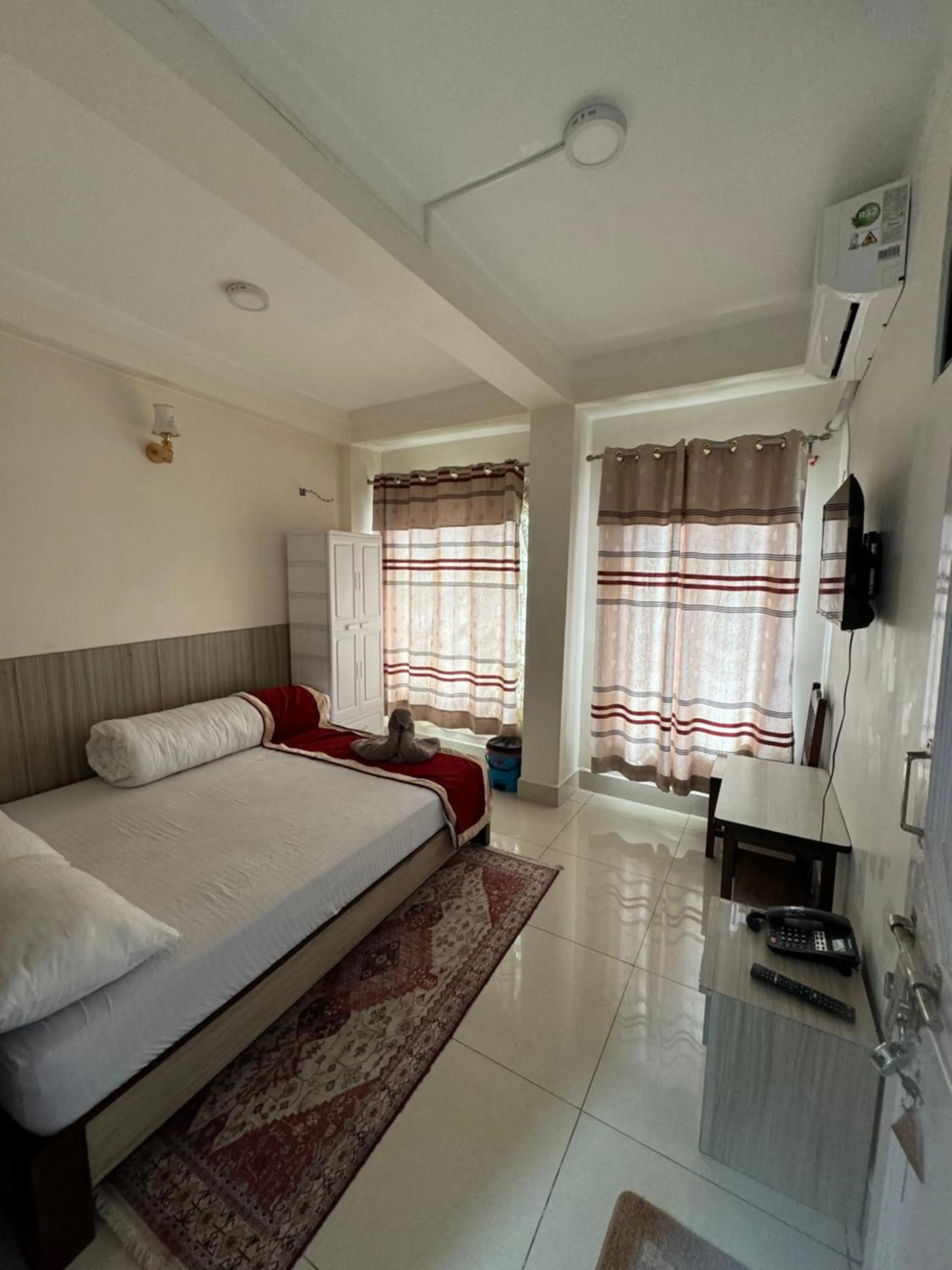 Bed in Om Bramha Hotel