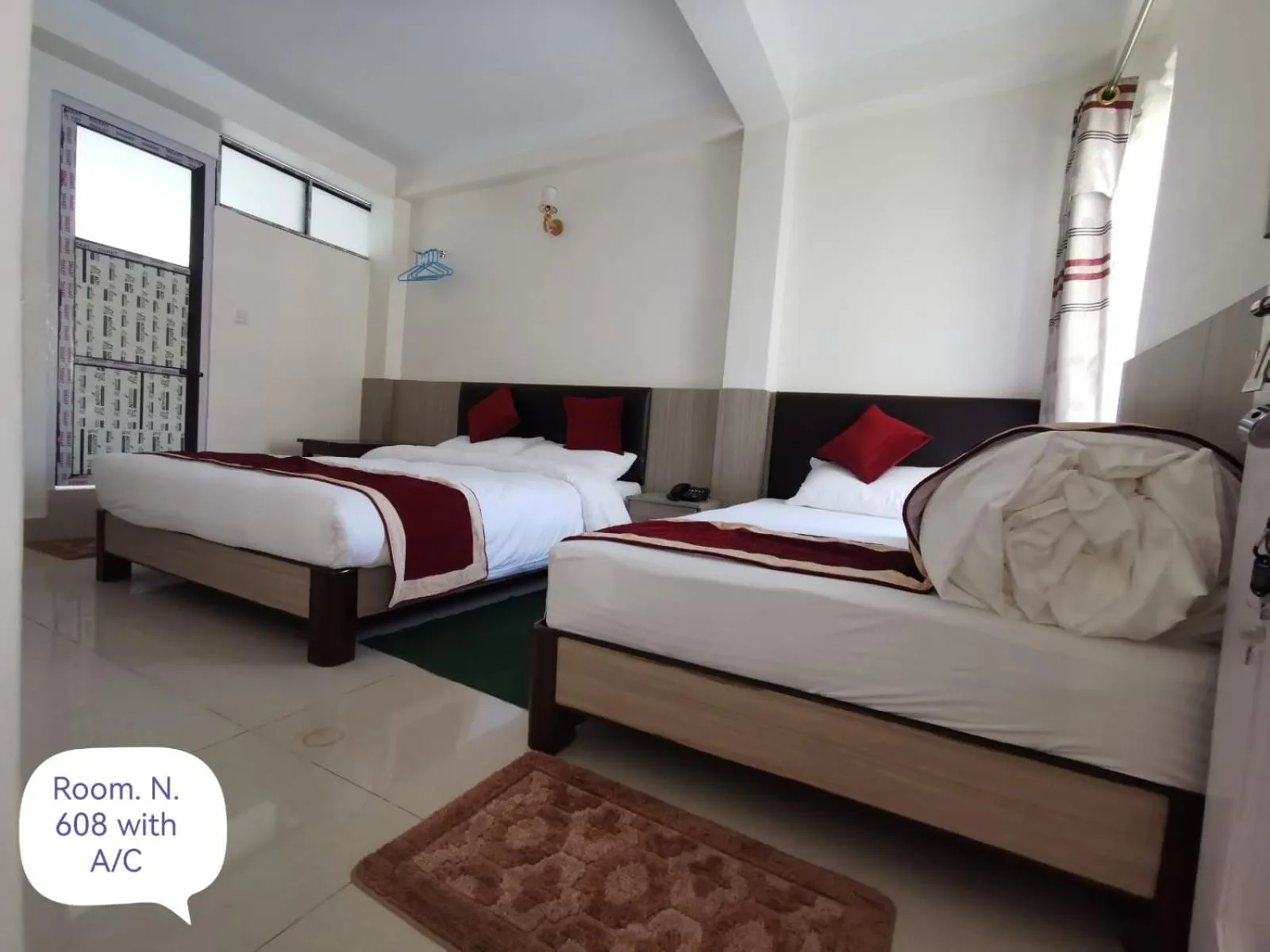 Photo of the whole room, Bed in Om Bramha Hotel
