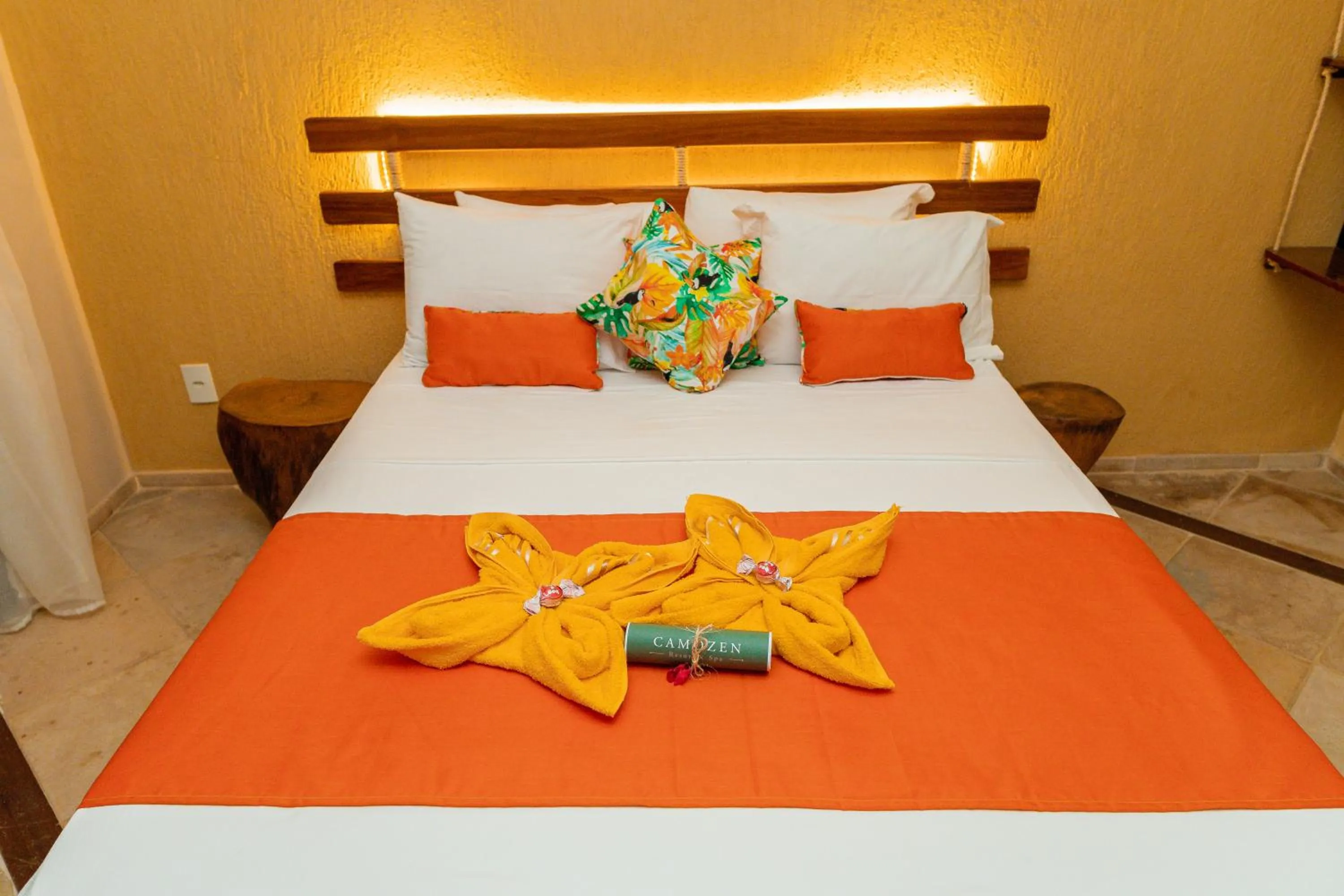 Bed in Camozen Resort & Spa