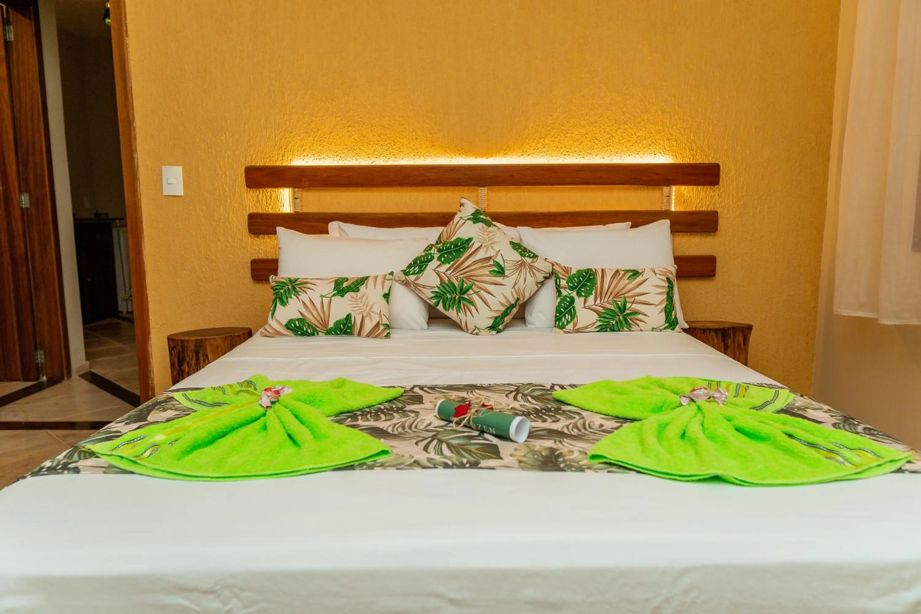 Bed in Camozen Resort & Spa