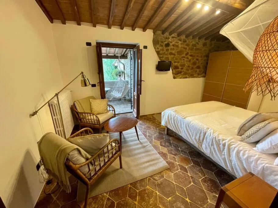 Bed in Tuscan Escape Luxury 2 bedroom apartment with pool