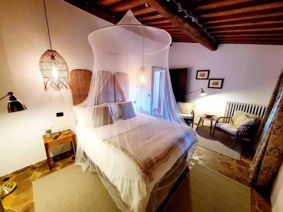 Bed in Tuscan Escape Luxury 2 bedroom apartment with pool