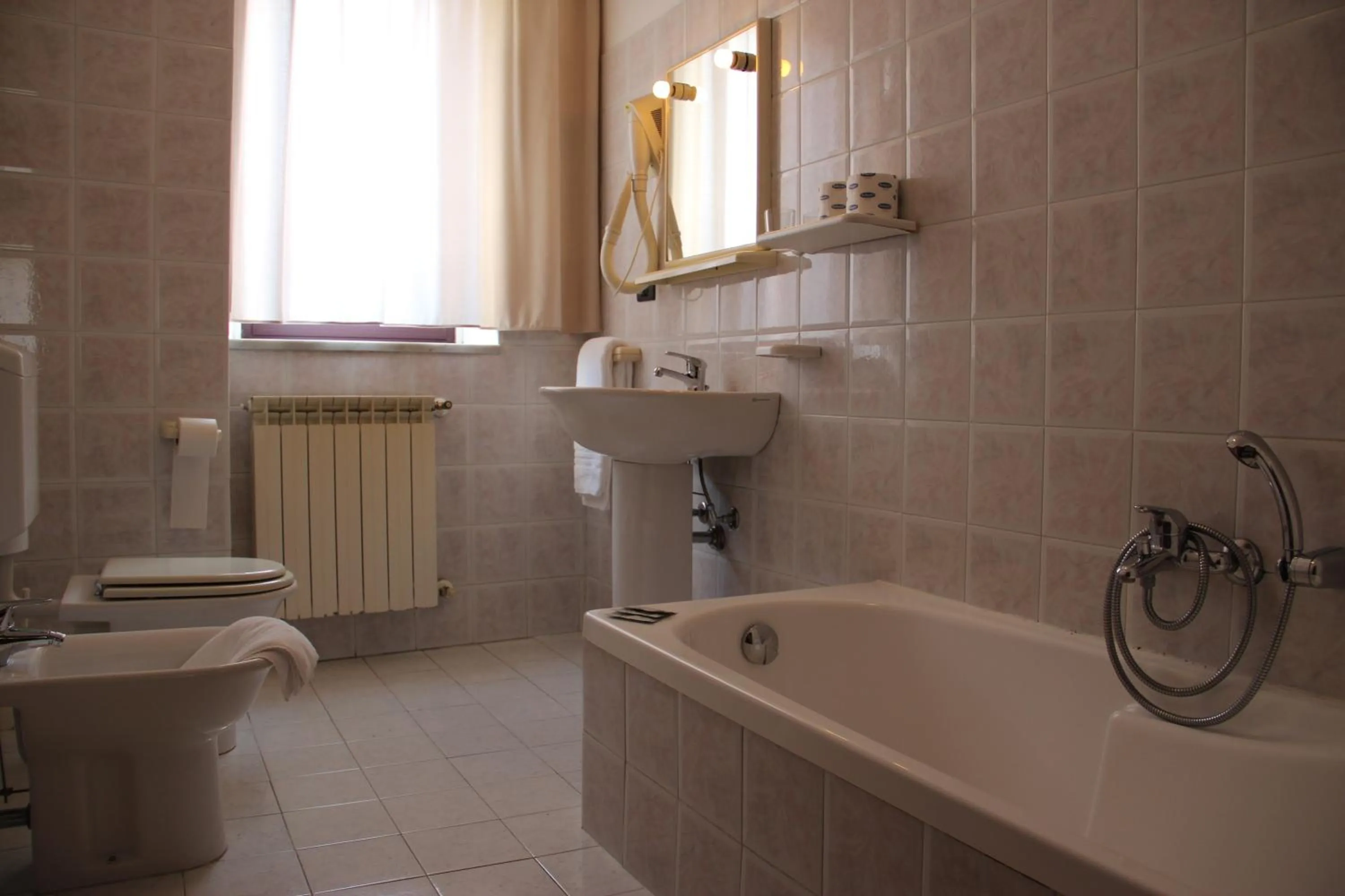 Bathroom in Demy Hotel