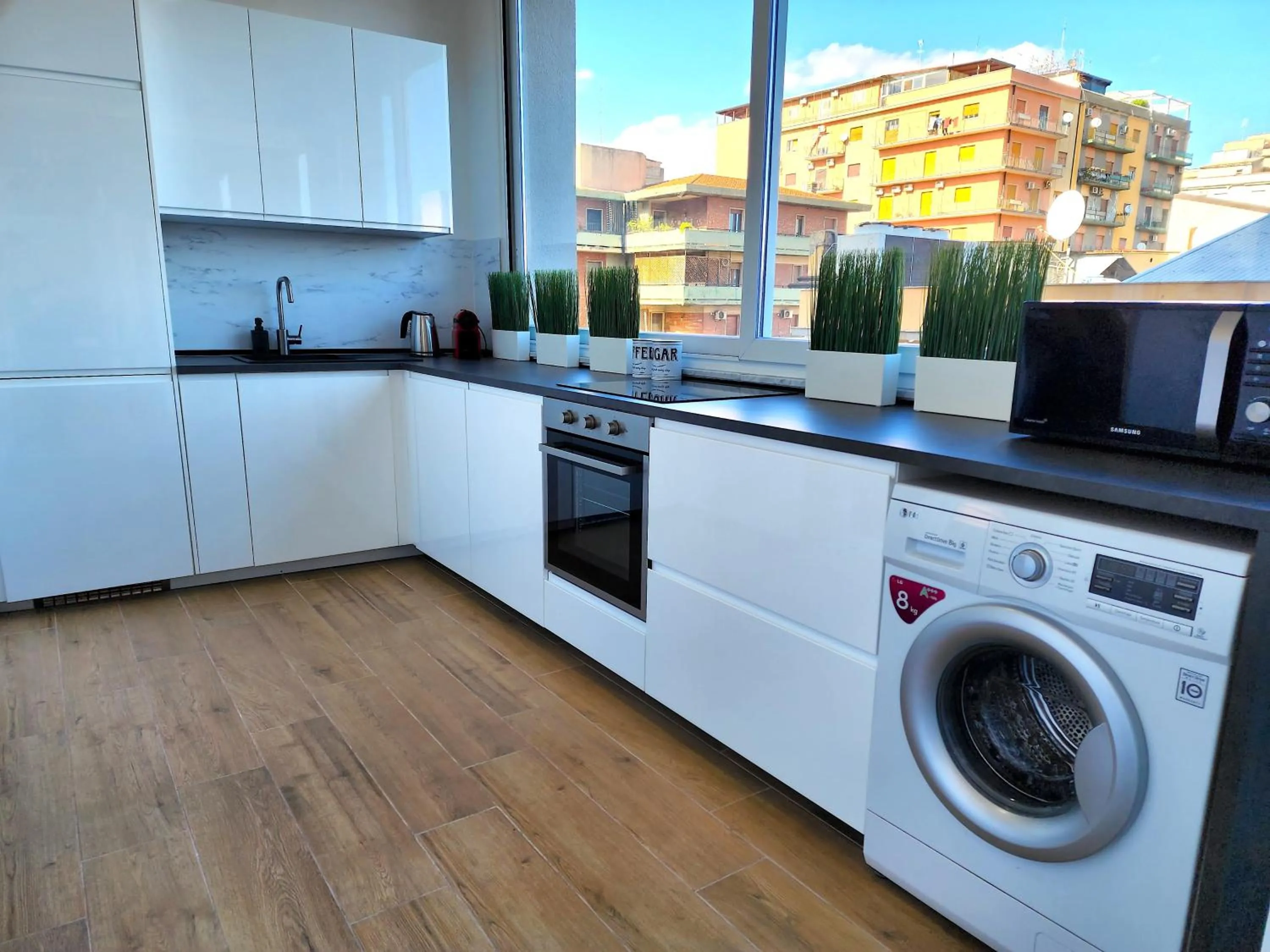 Kitchen or kitchenette in BACARDI Lungomare - Modern apartment near the sea