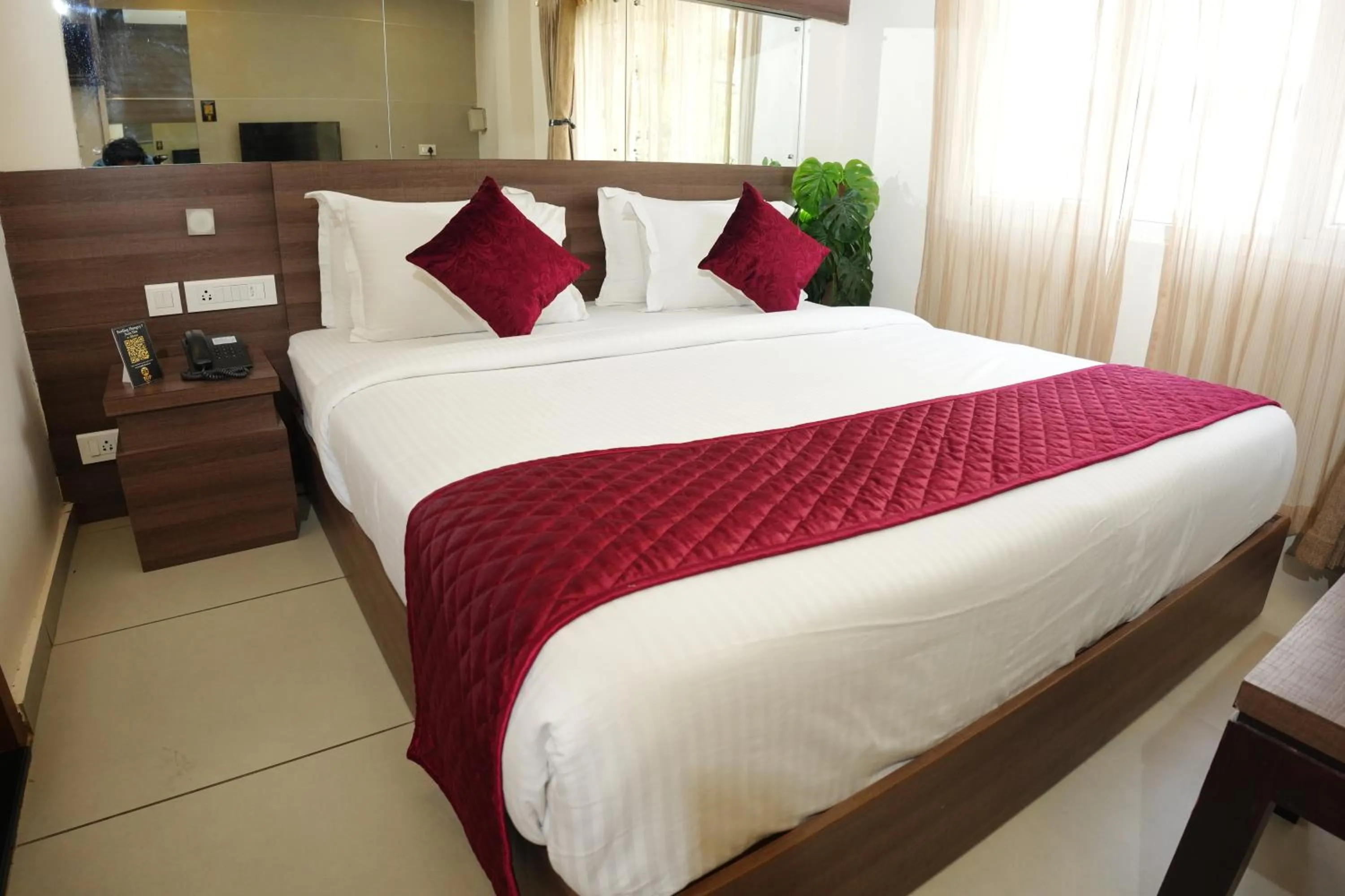 Photo of the whole room, Bed in Hotel Palmyra Grand Inn - Kochi