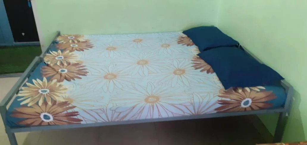 Bed in JEENA MOTEL
