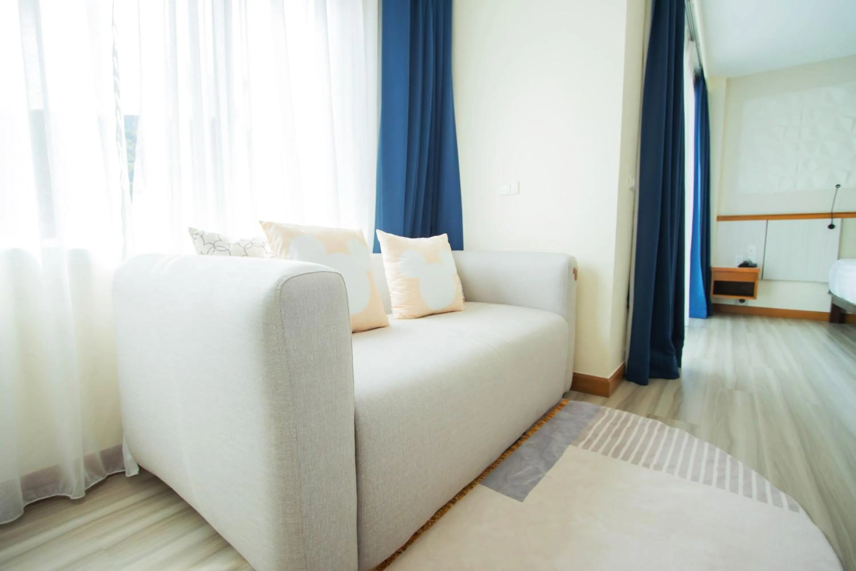 Living room, Bed in Sira Grande Hotel & Spa, Patong