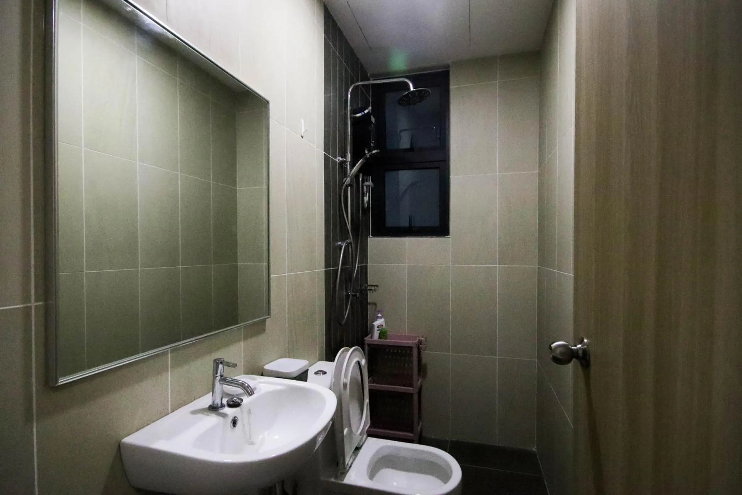 Bathroom in Legasi Kampung Baru by Airhost