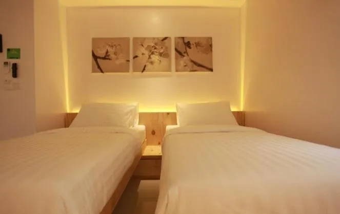 Bed in PINE LODGE MALDIVES