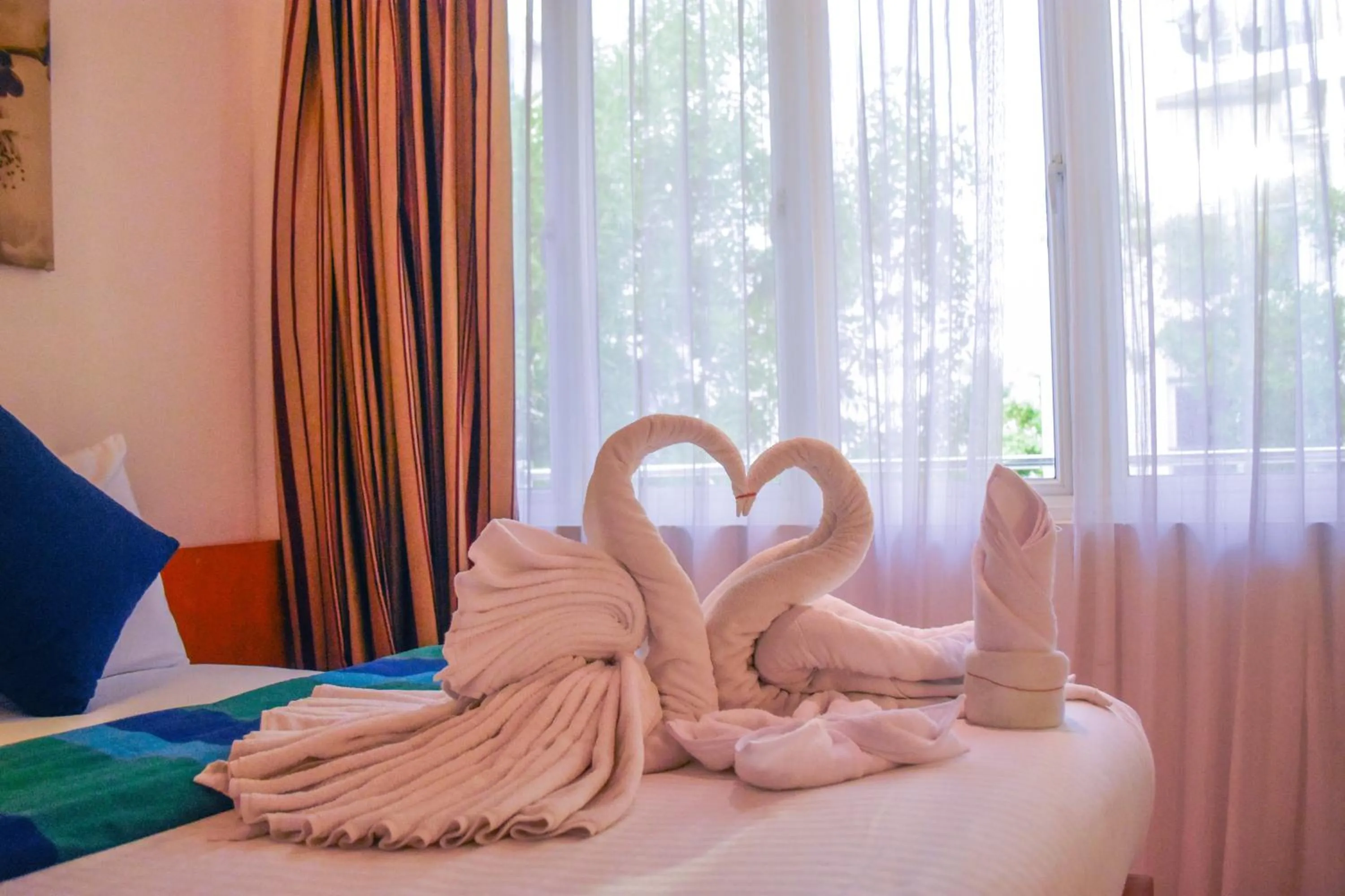 Bed in PINE LODGE MALDIVES