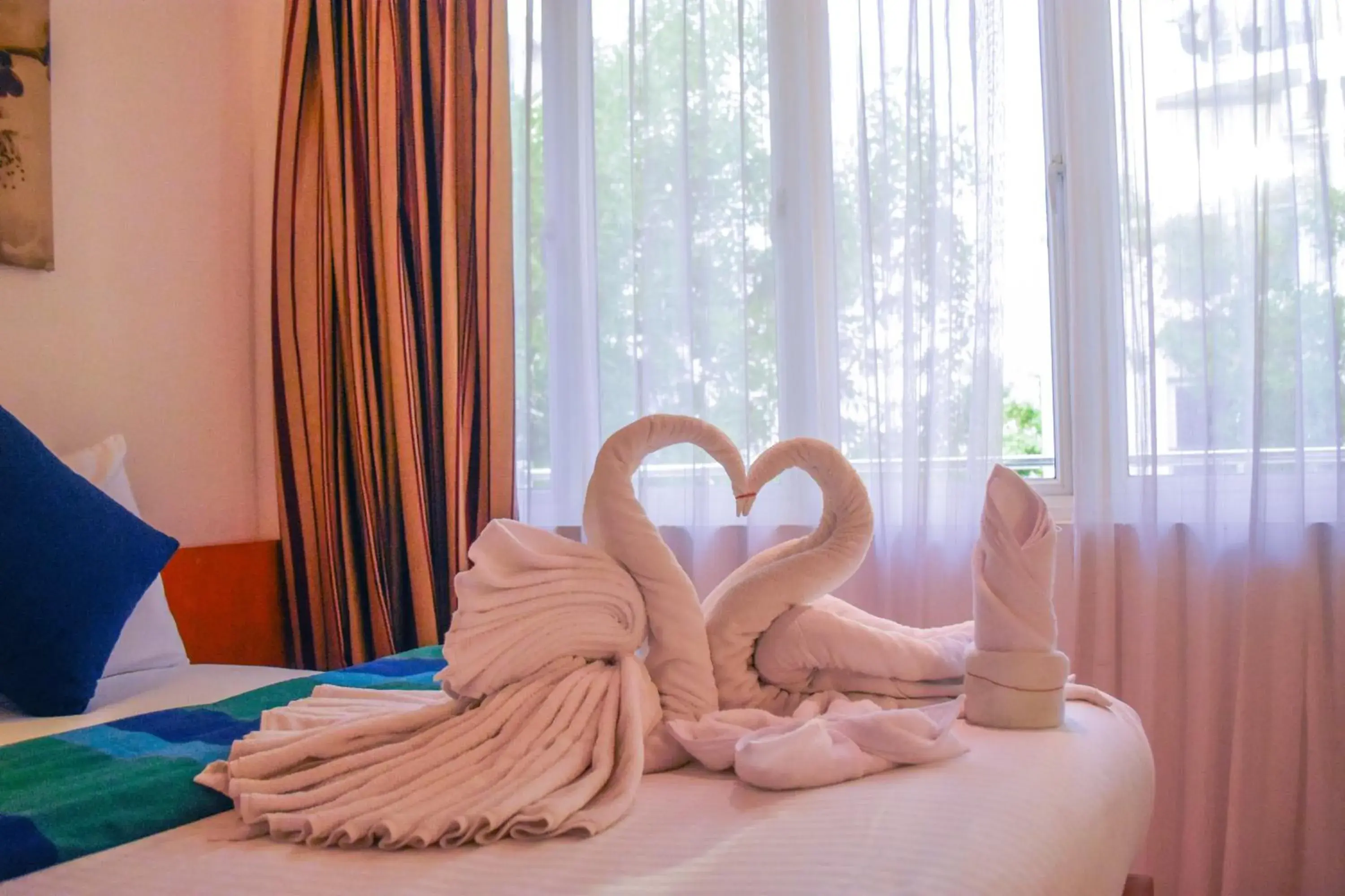 Bed in PINE LODGE MALDIVES Bed in PINE LODGE MALDIVES