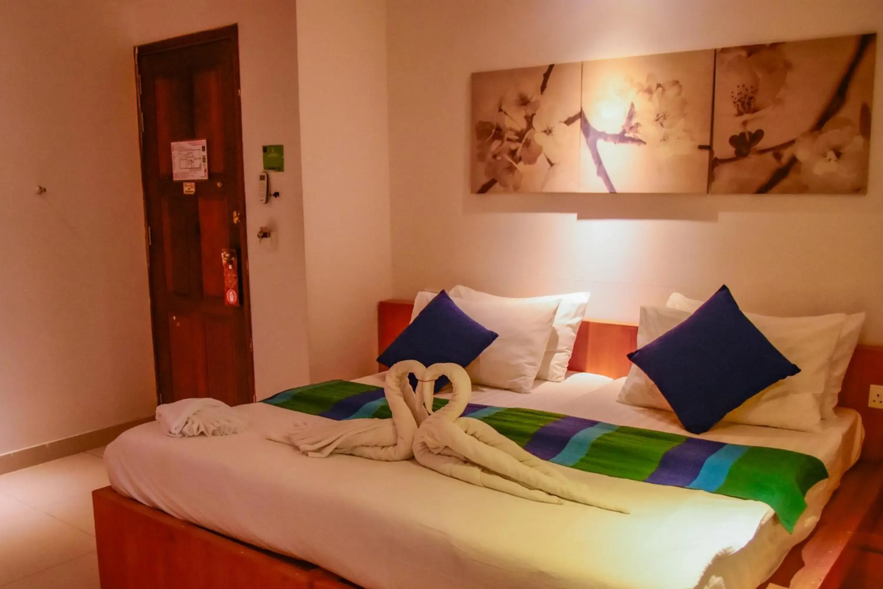 Bed in PINE LODGE MALDIVES Bed in PINE LODGE MALDIVES