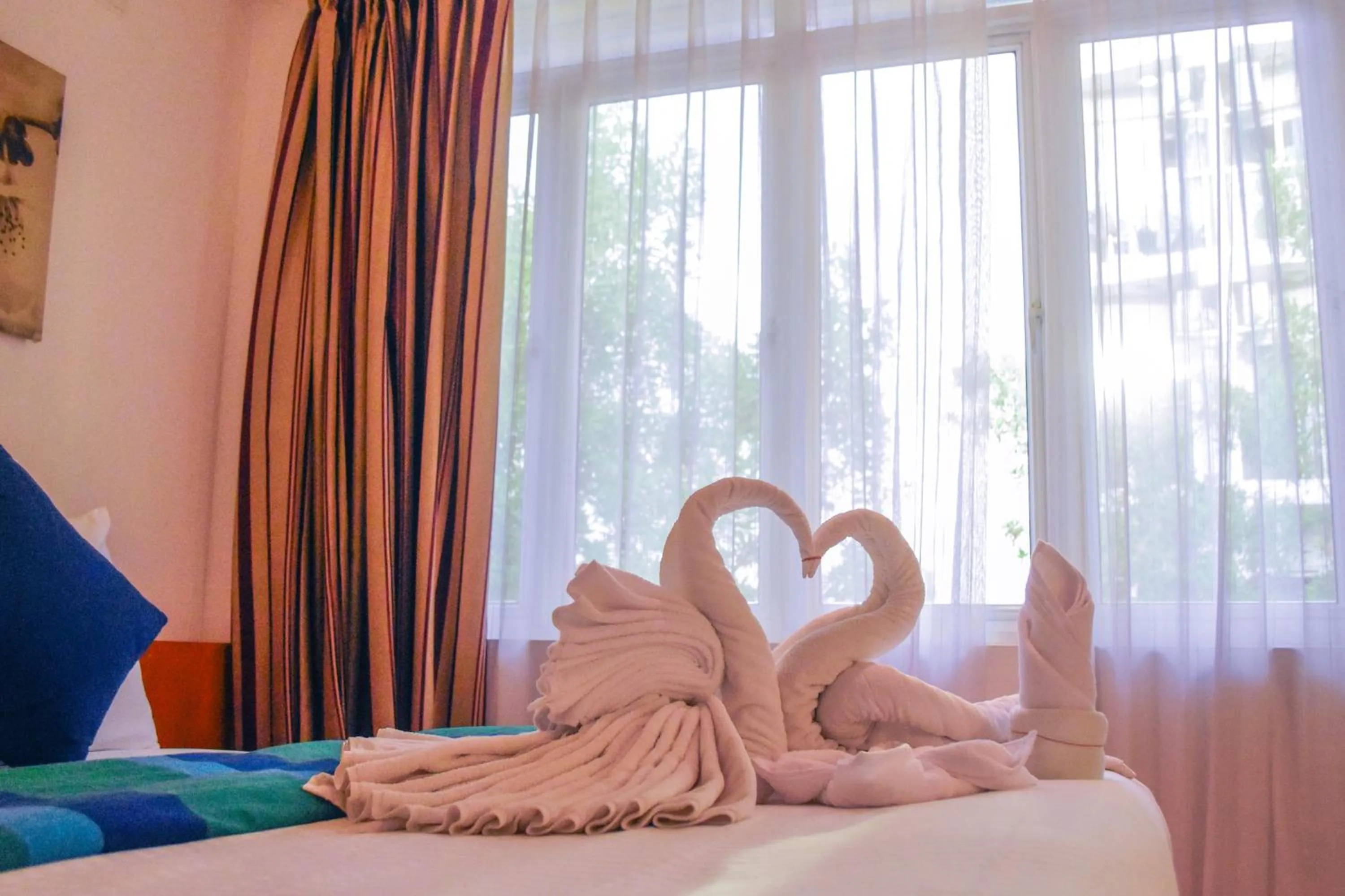 Bed in PINE LODGE MALDIVES