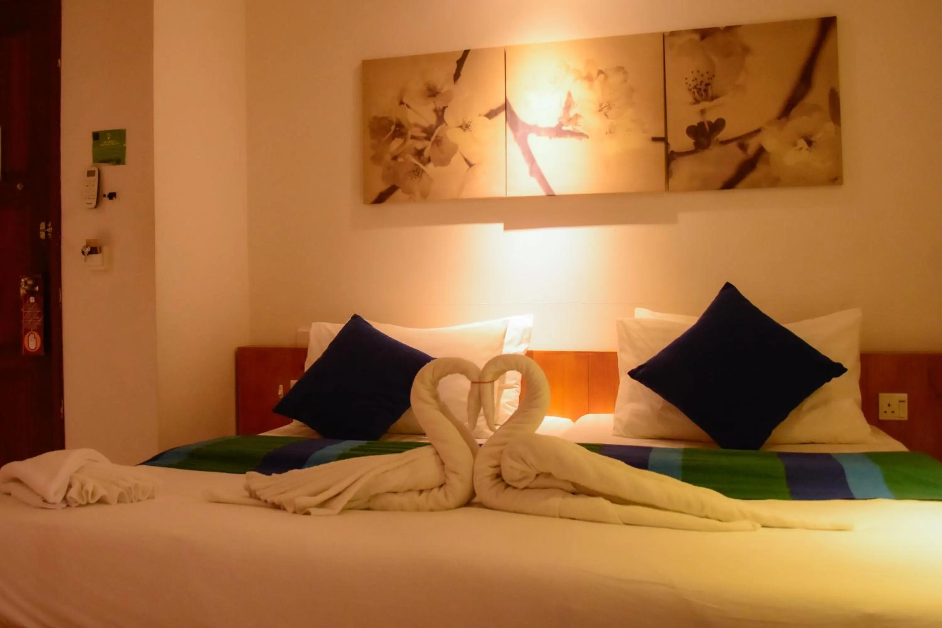 Bed in PINE LODGE MALDIVES