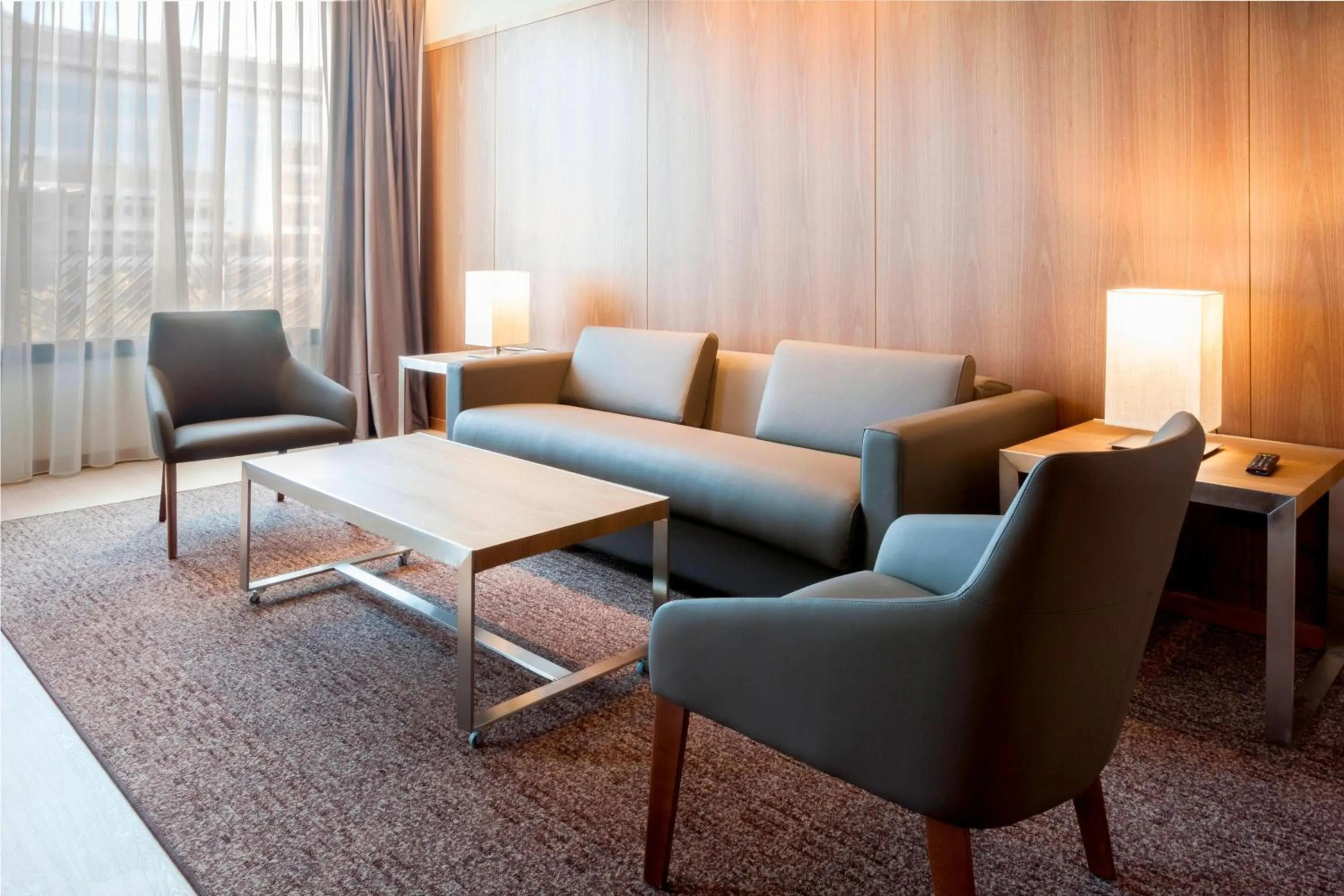 Living room in AC Hotel Diagonal L'Illa by Marriott