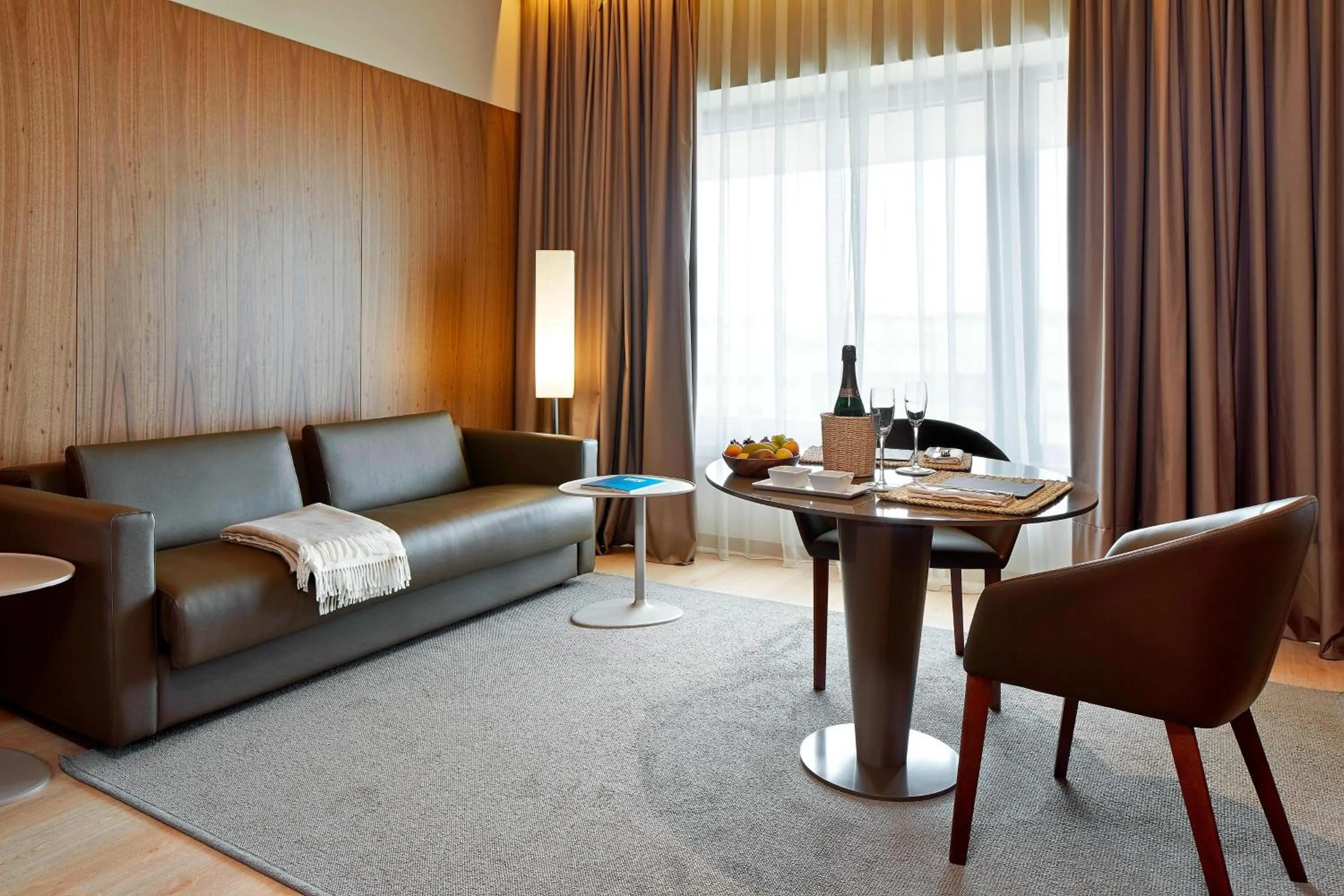 Living room in AC Hotel Diagonal L'Illa by Marriott