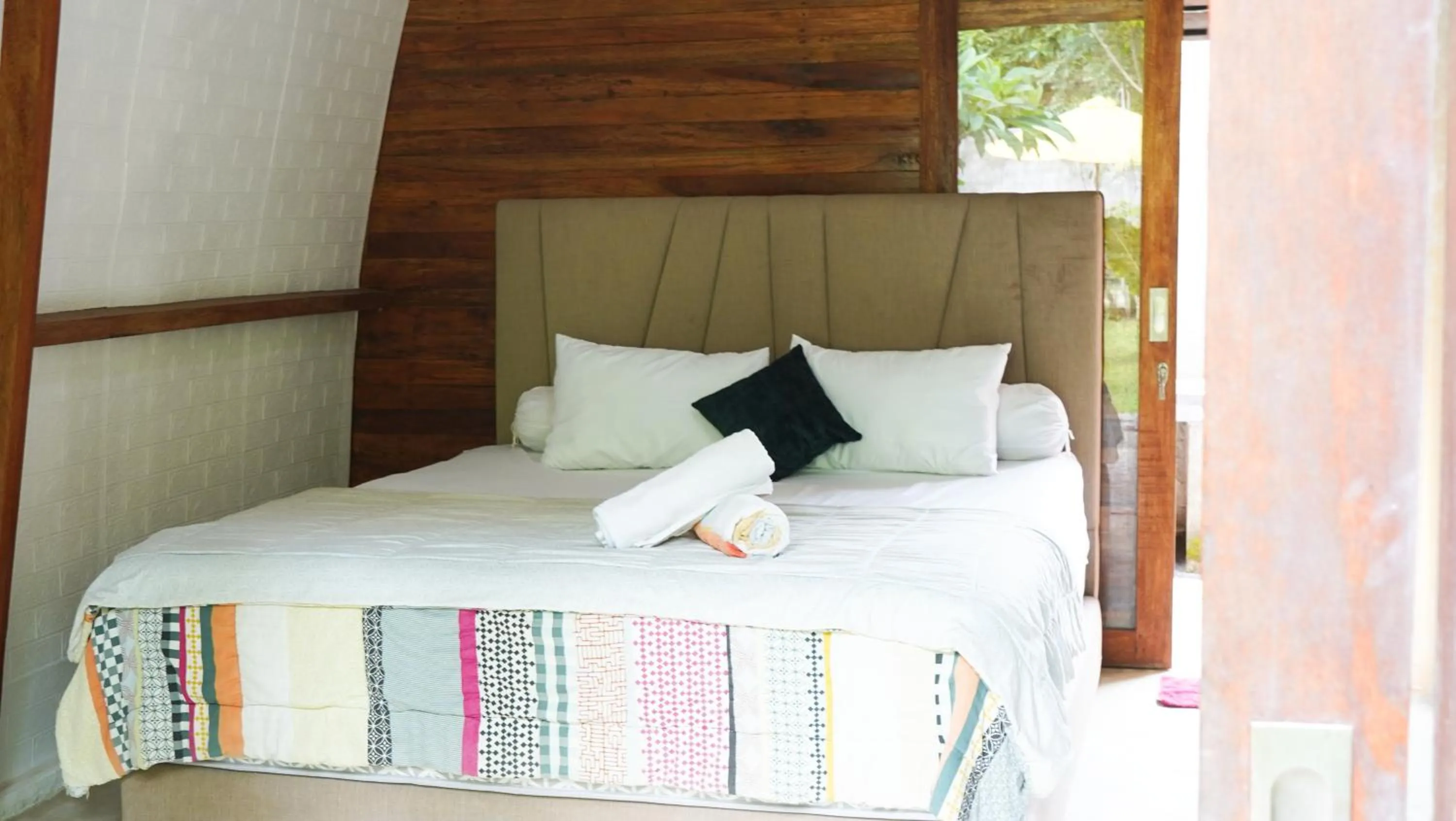 Bed in Lullabi Lumbung Villa