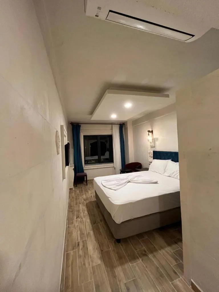 Bed in MİDYAT LADİNOS OTEL
