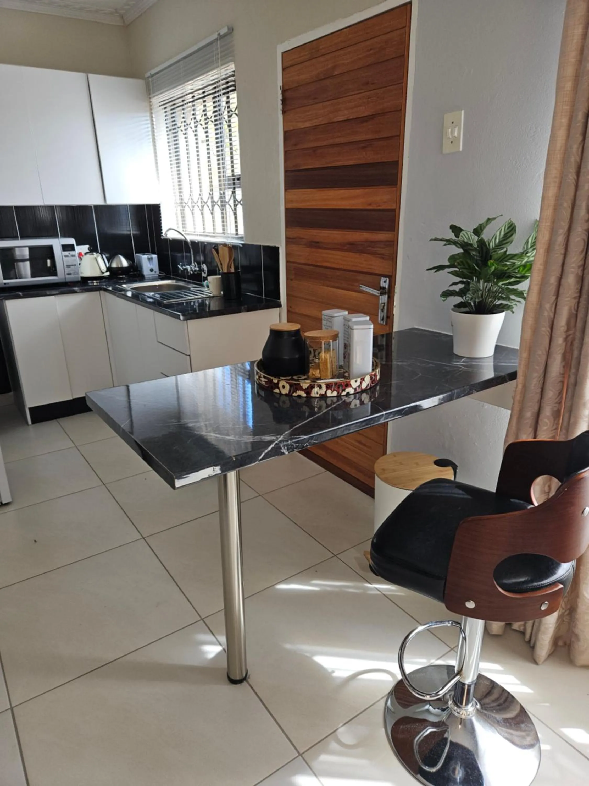 Kitchen or kitchenette in Three Stones Executive Apartments