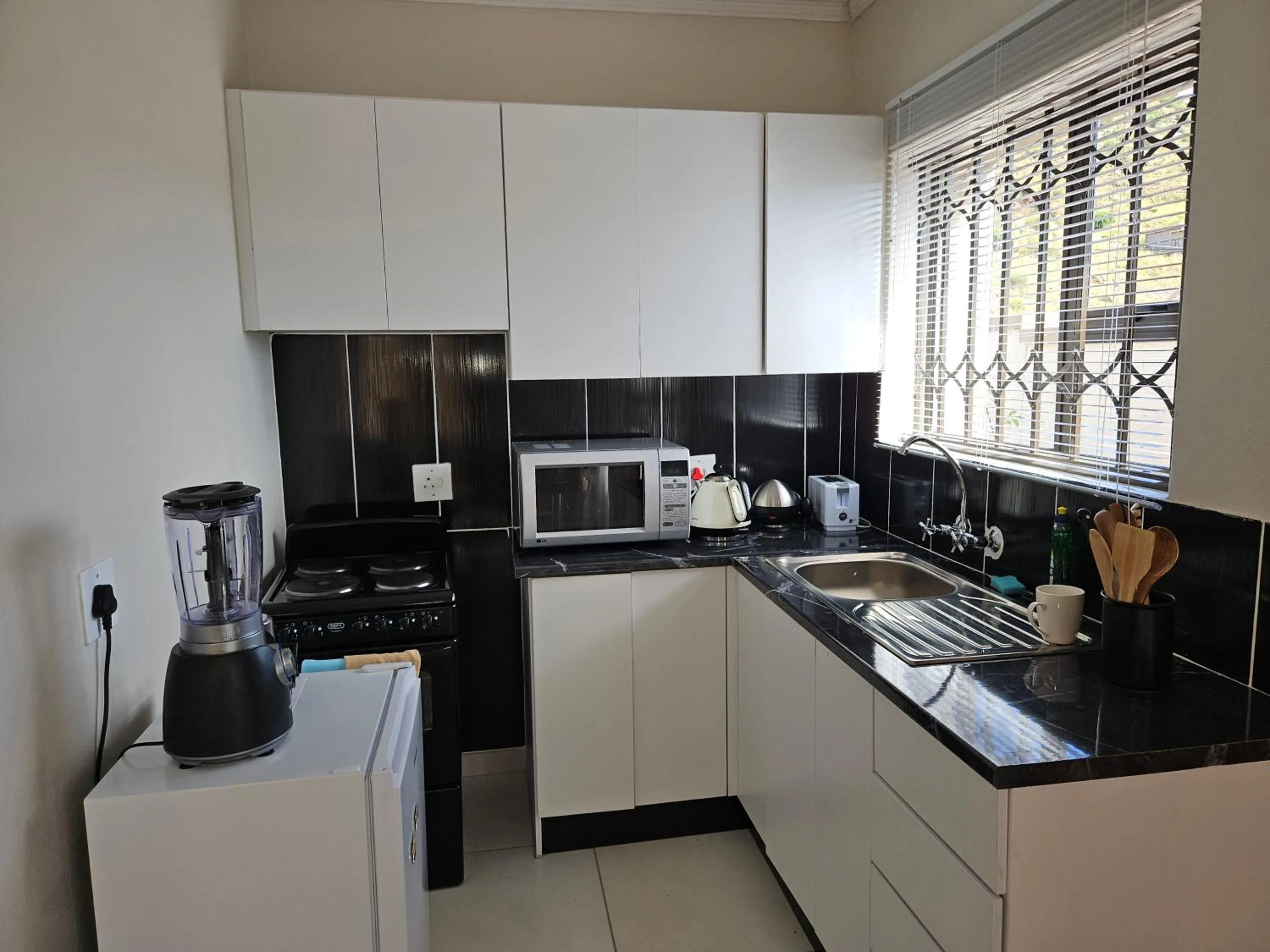 Kitchen or kitchenette in Three Stones Executive Apartments