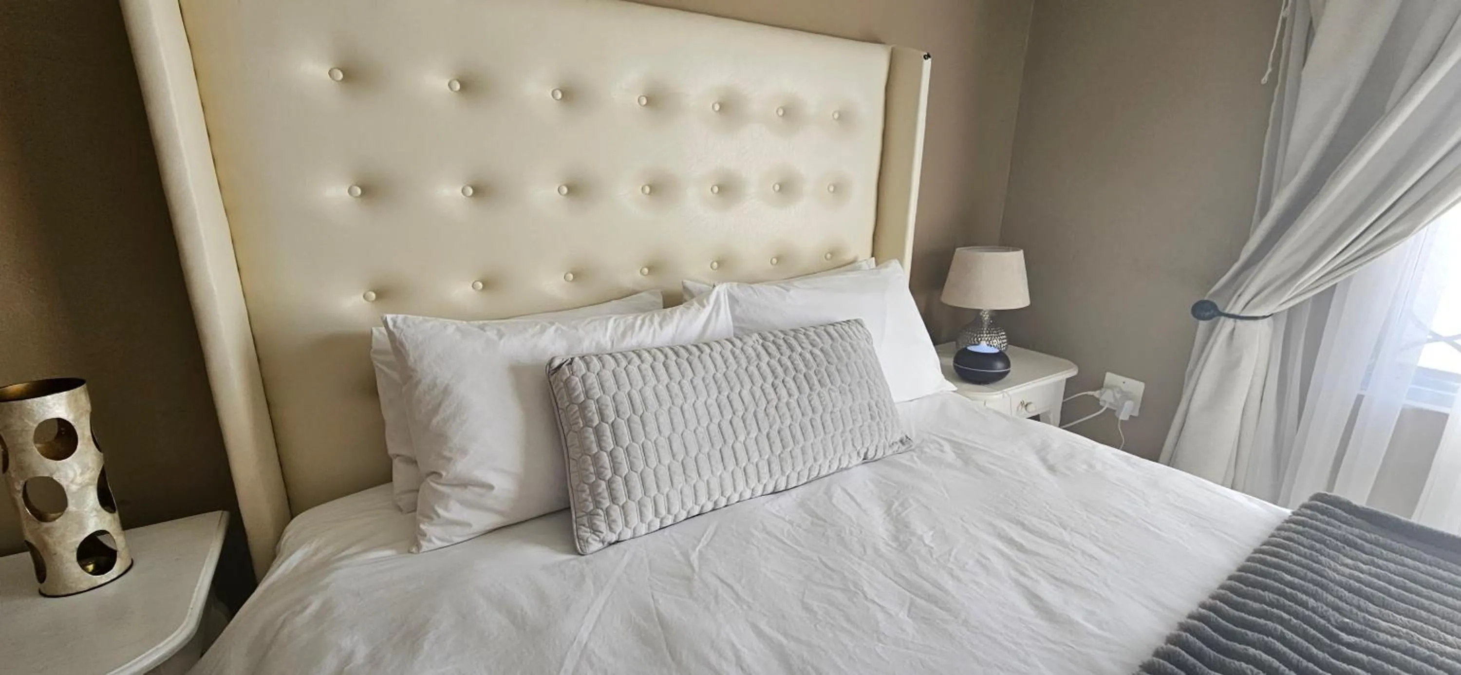Bed in Three Stones Executive Apartments