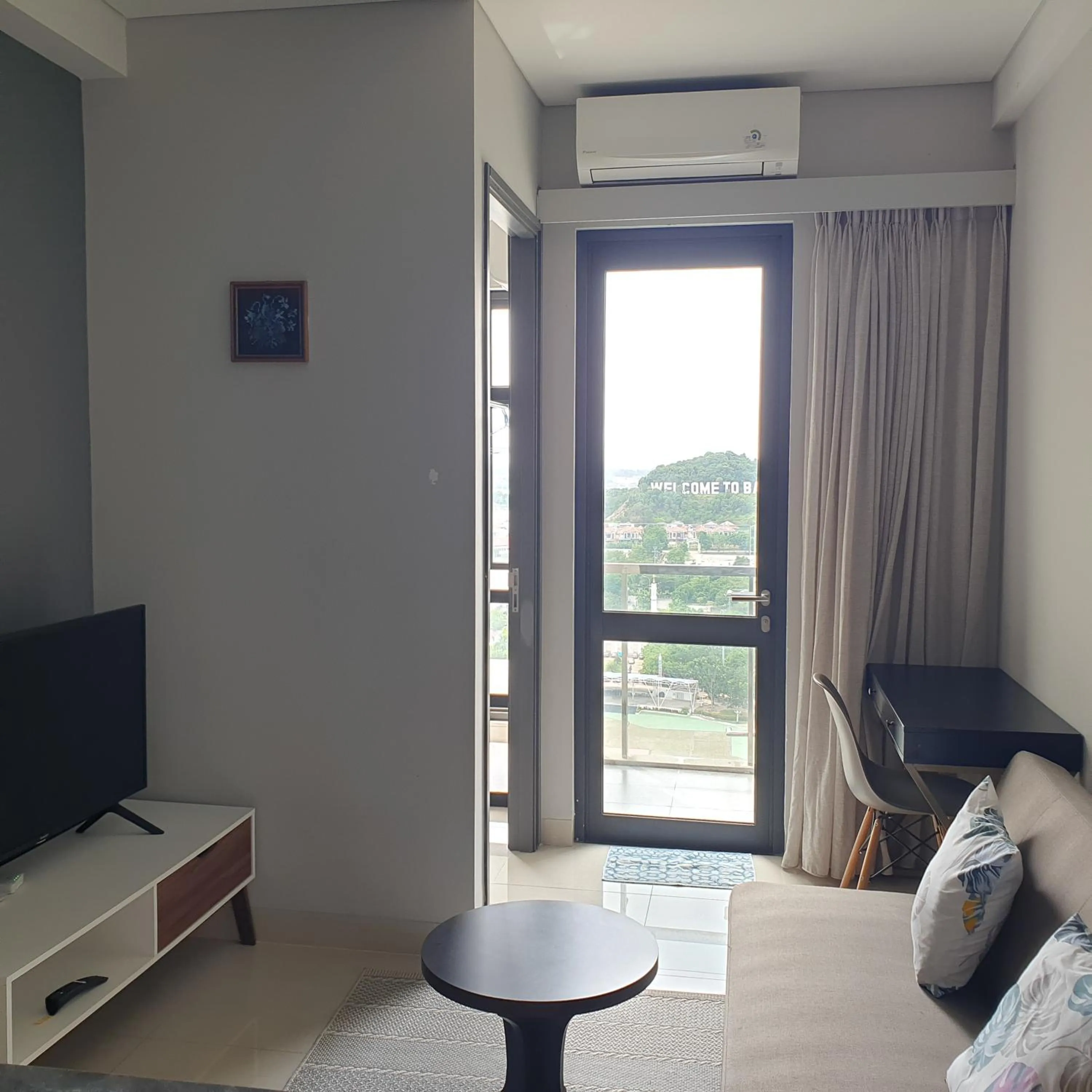 Living room in CozyHomes at One Residence Batam