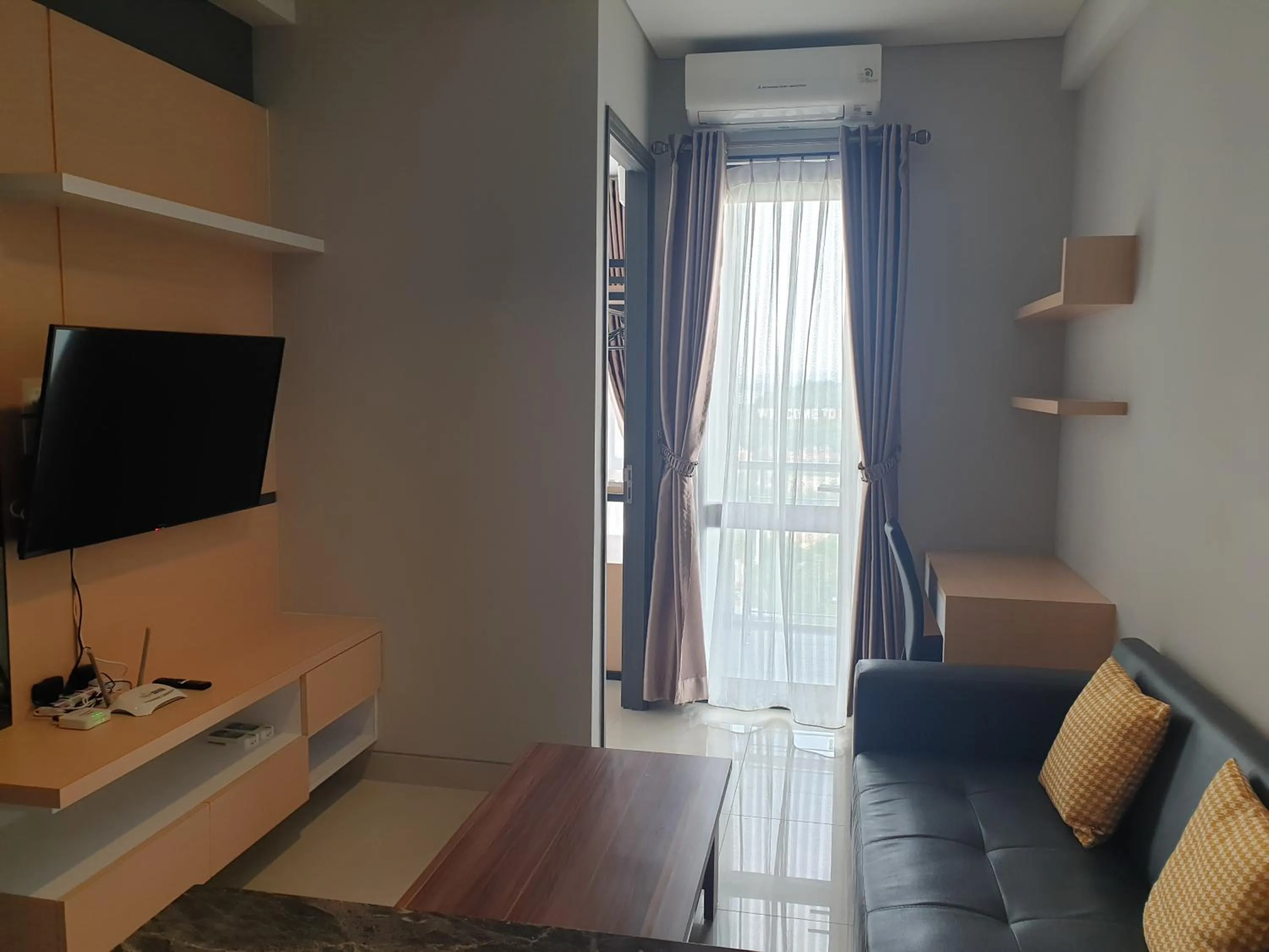 Living room in CozyHomes at One Residence Batam