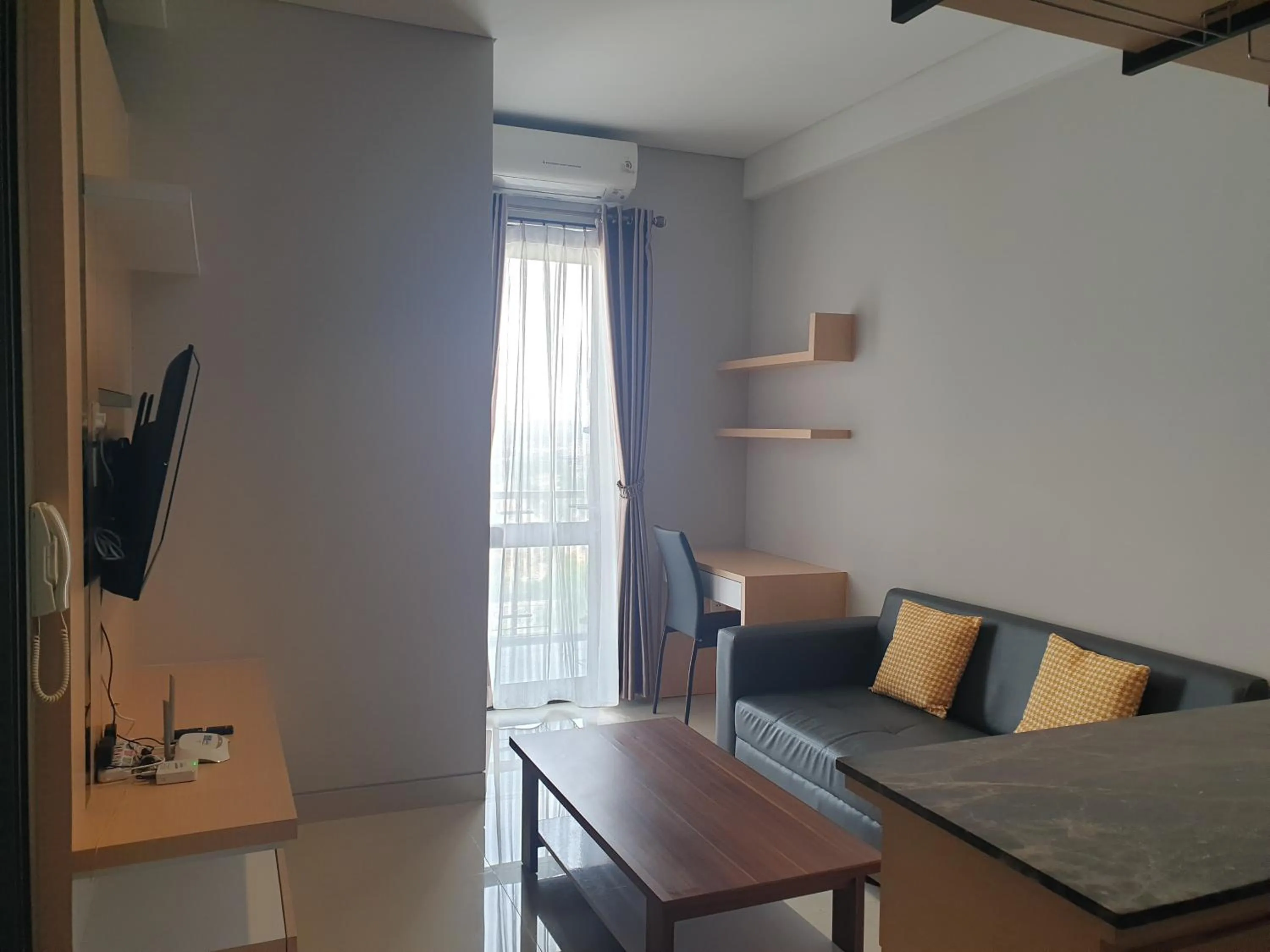 Living room in CozyHomes at One Residence Batam