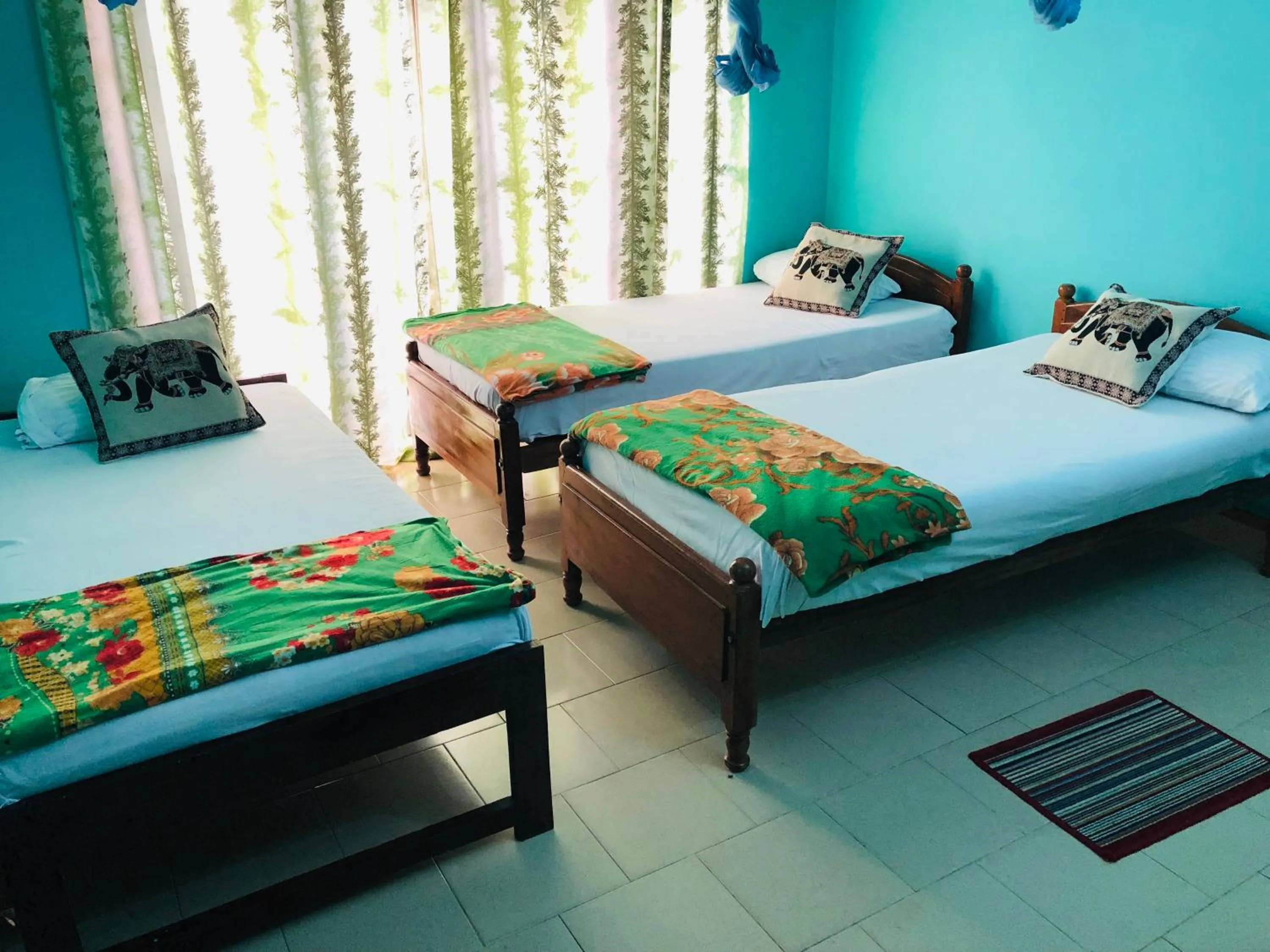 Bed in Araliya Holiday Bungalow