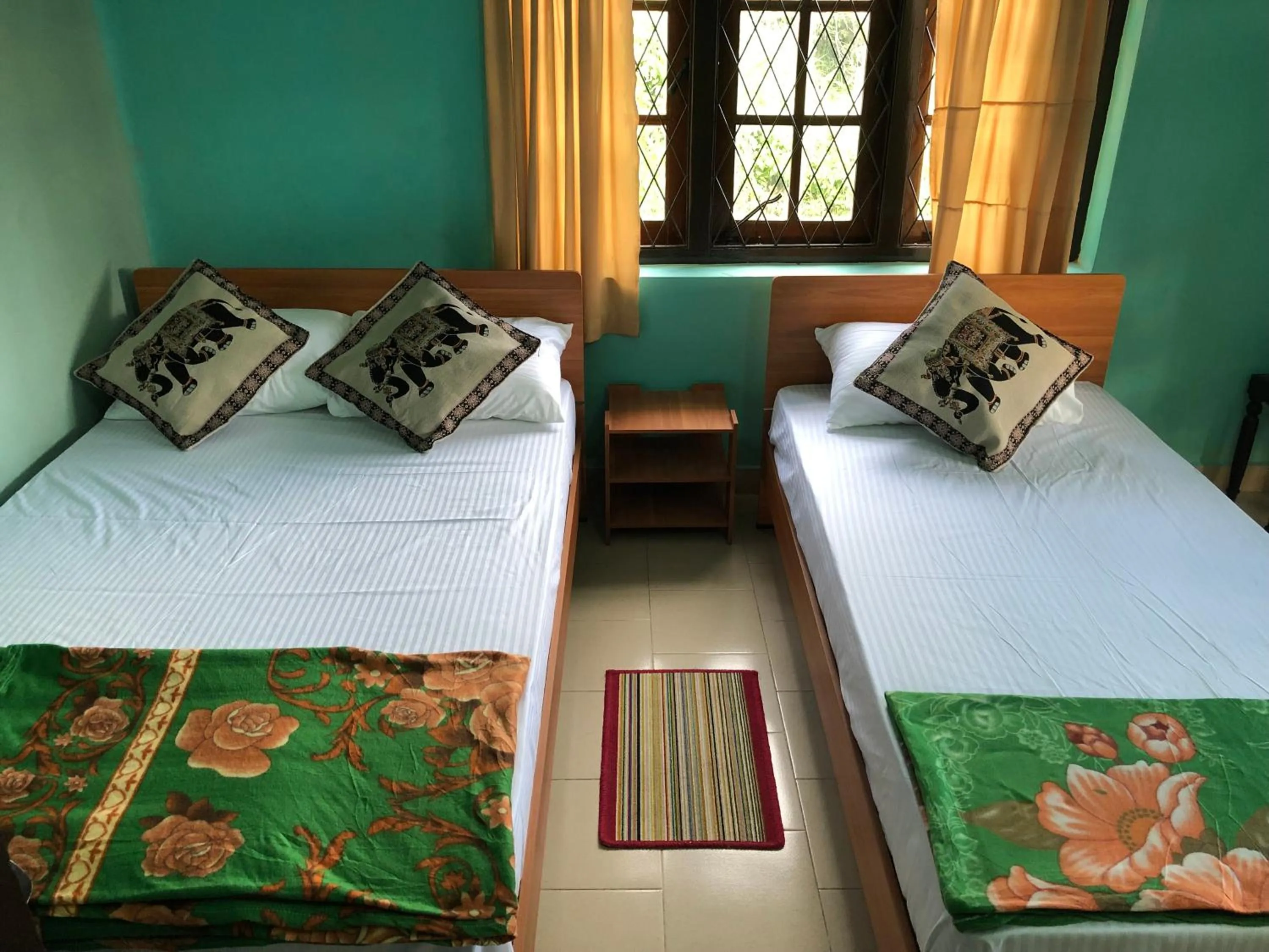 Bed in Araliya Holiday Bungalow