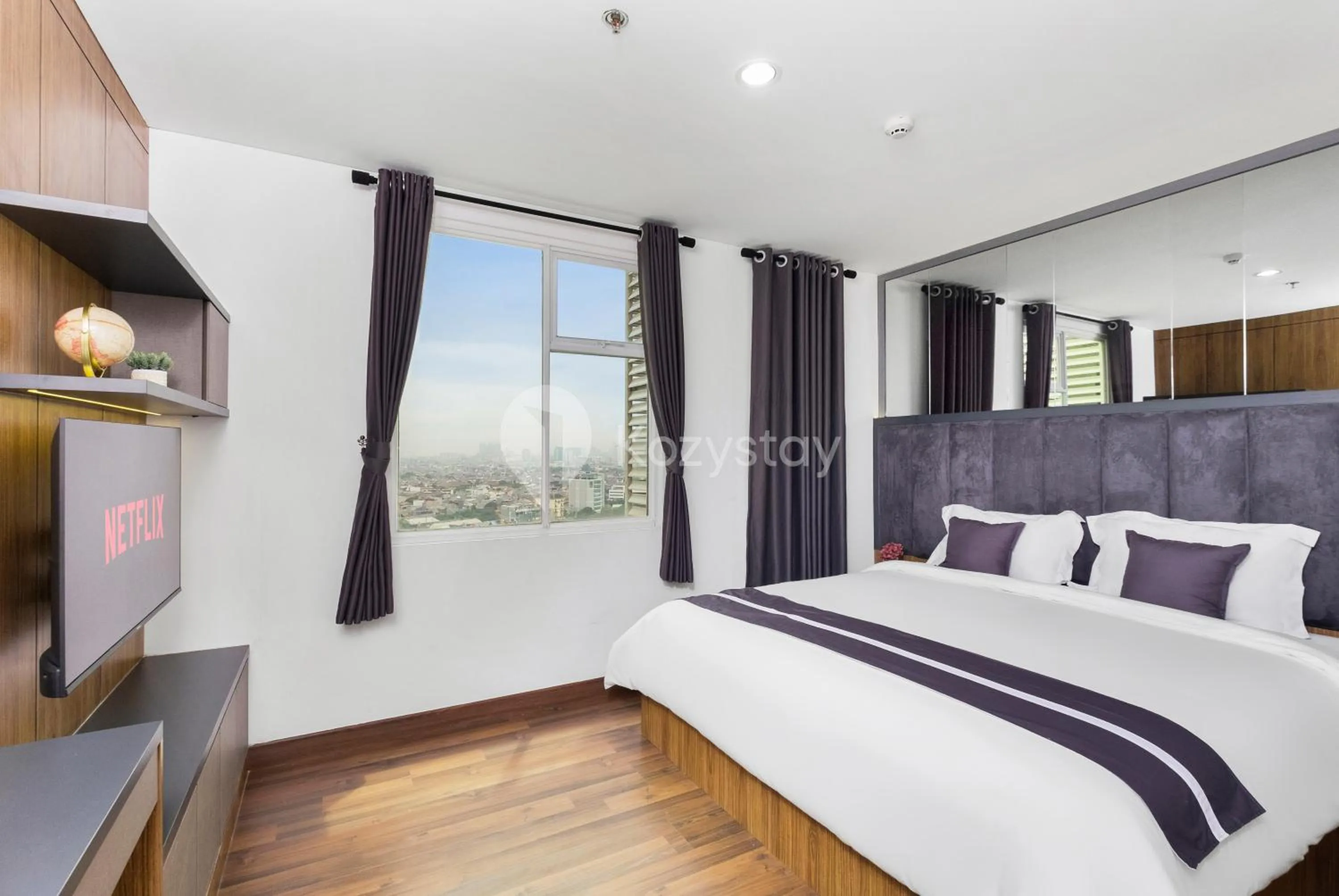 Bedroom, Bed in Orchid by Kozystay - Kebon Jeruk