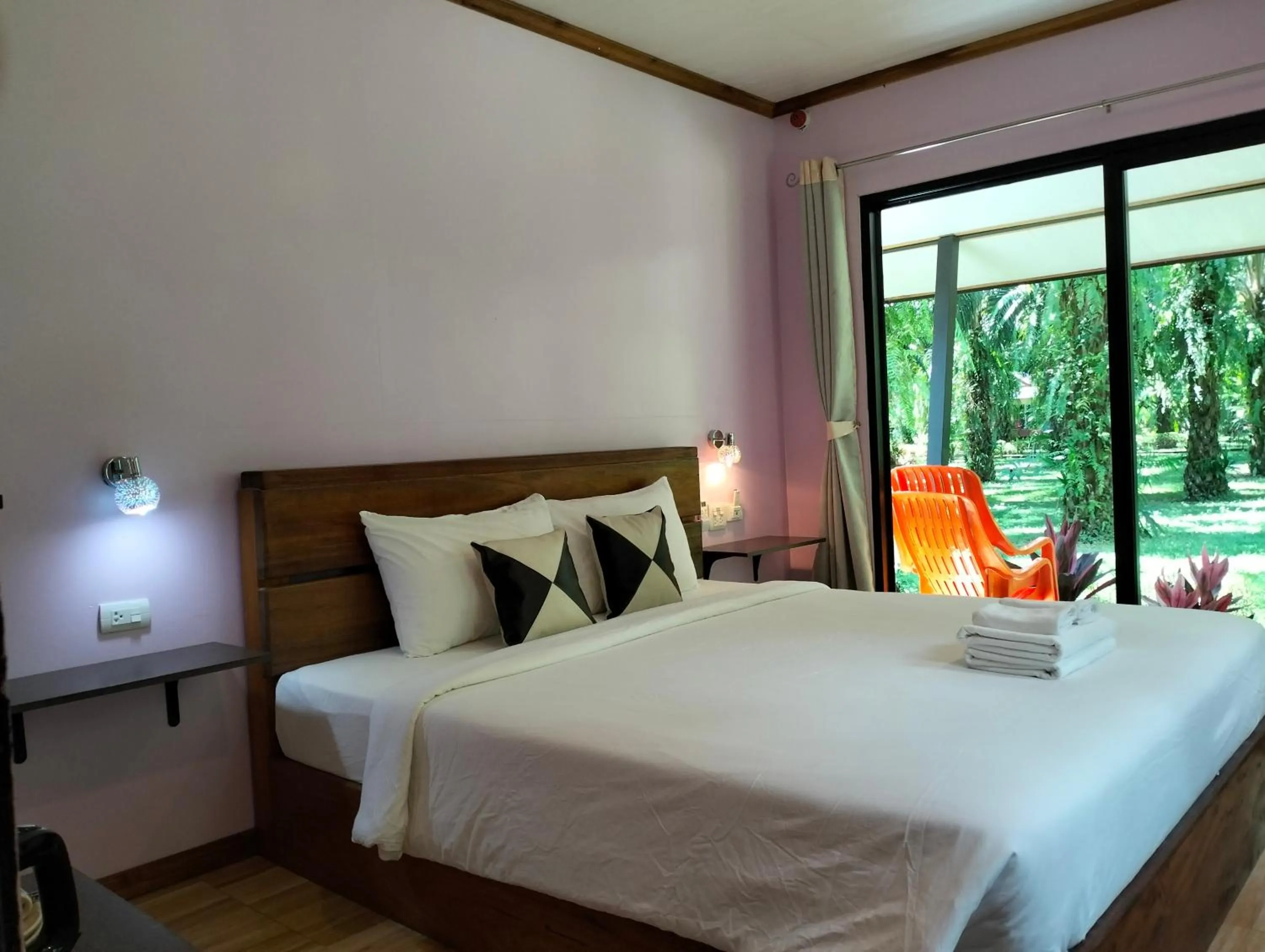 Bed in Khao Sok Palm Garden Resort