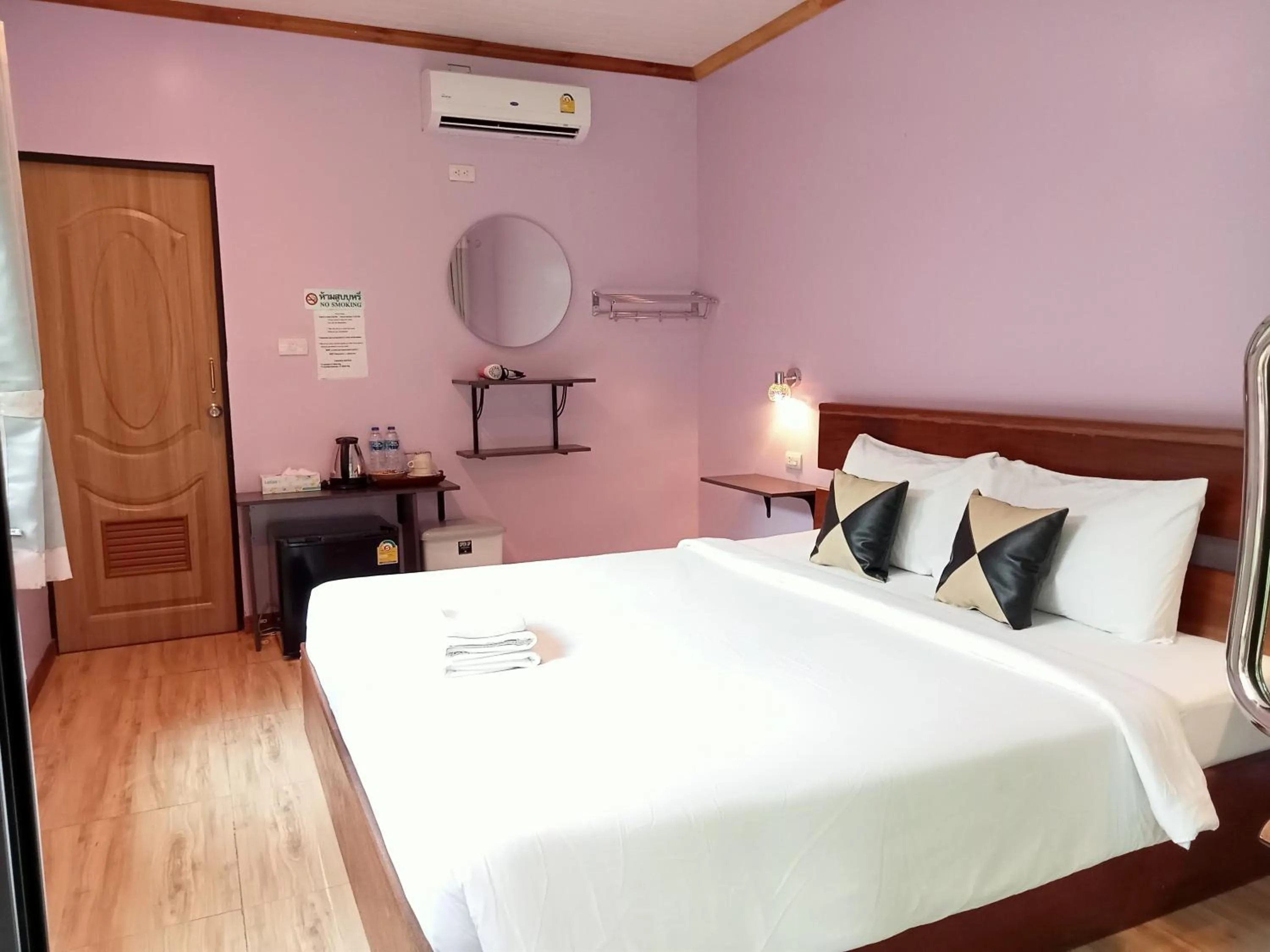 Bed in Khao Sok Palm Garden Resort