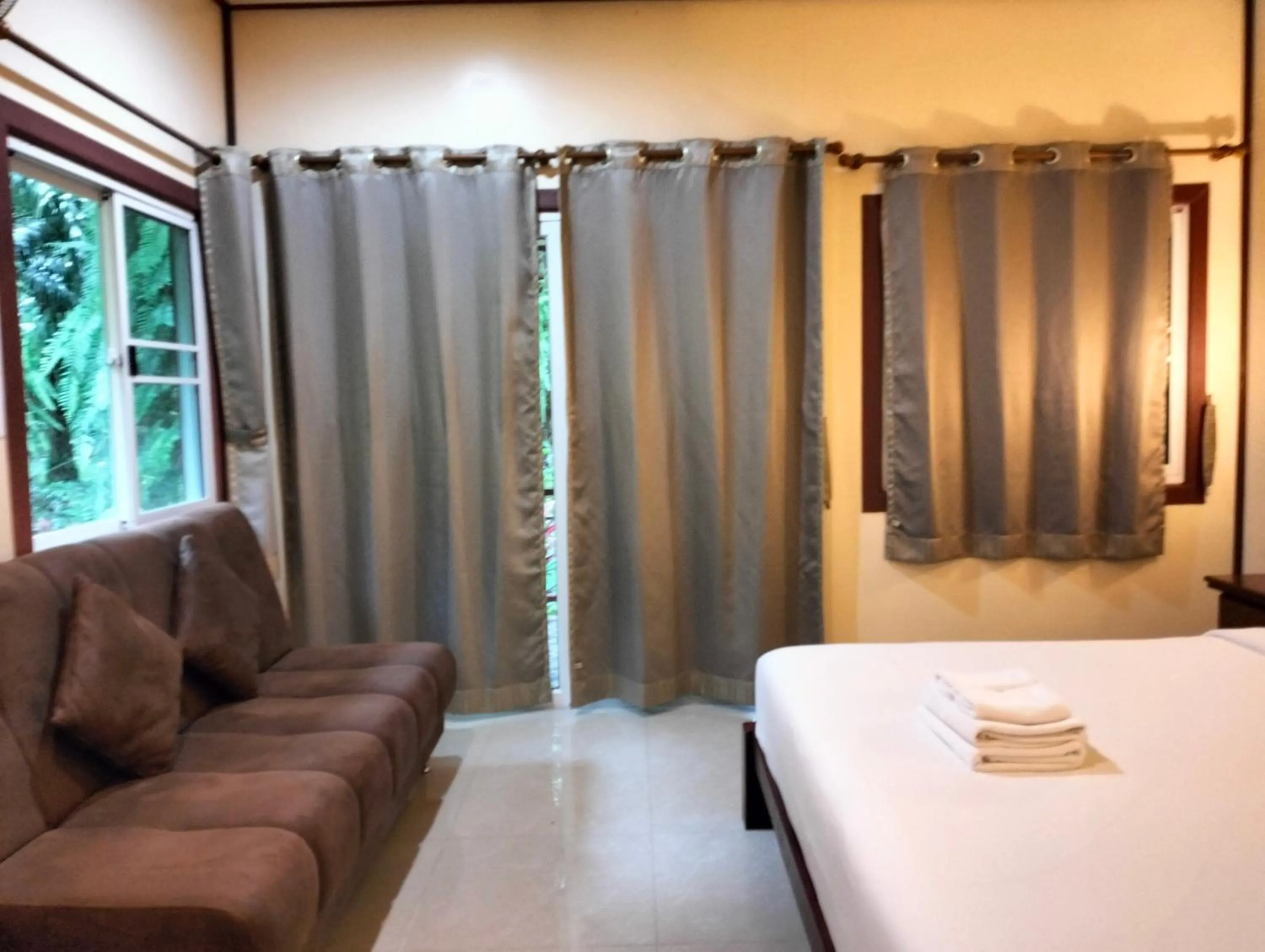 Bed in Khao Sok Palm Garden Resort