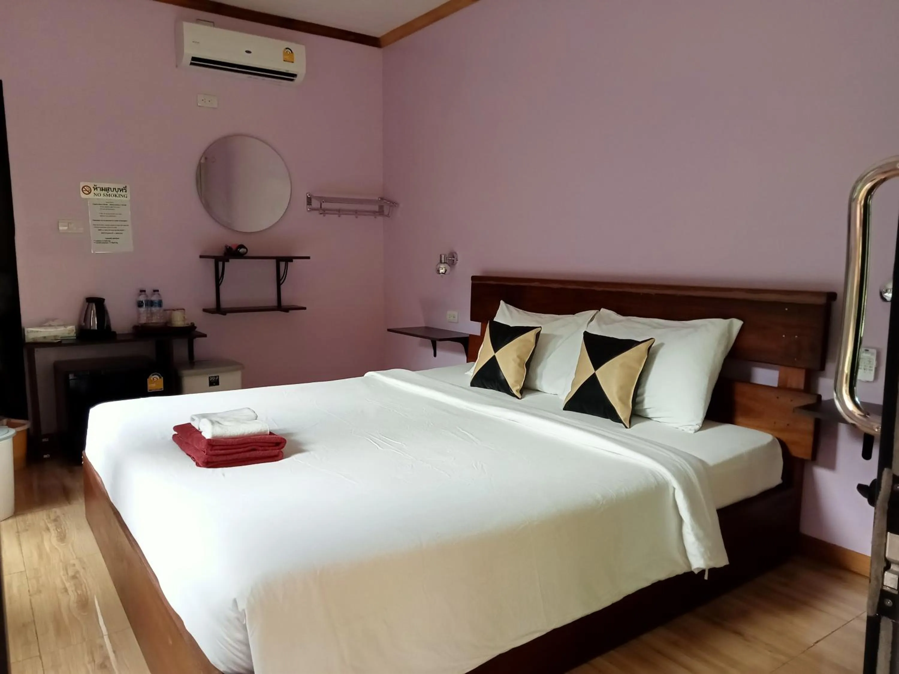 Bed in Khao Sok Palm Garden Resort