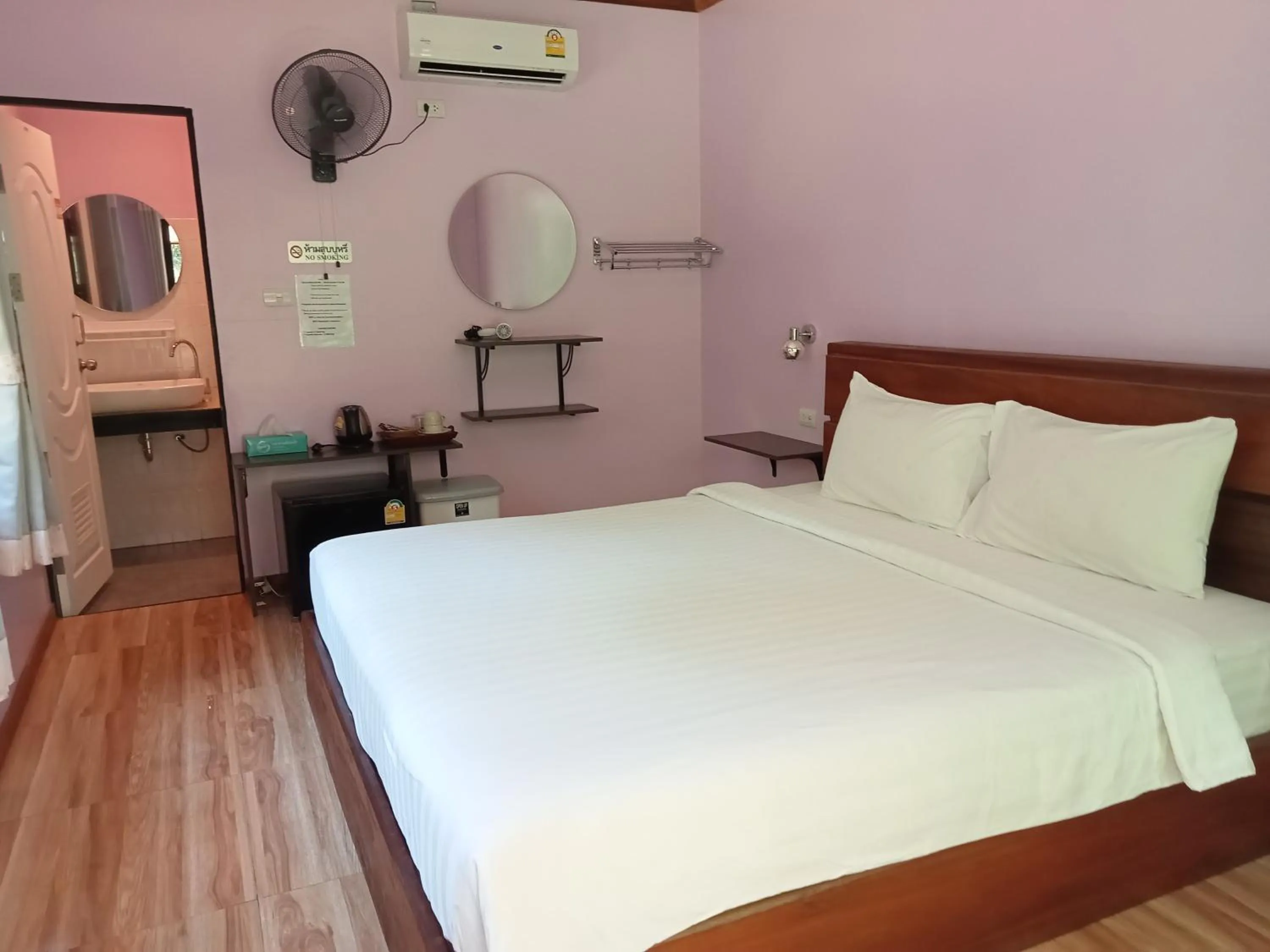 Bed in Khao Sok Palm Garden Resort