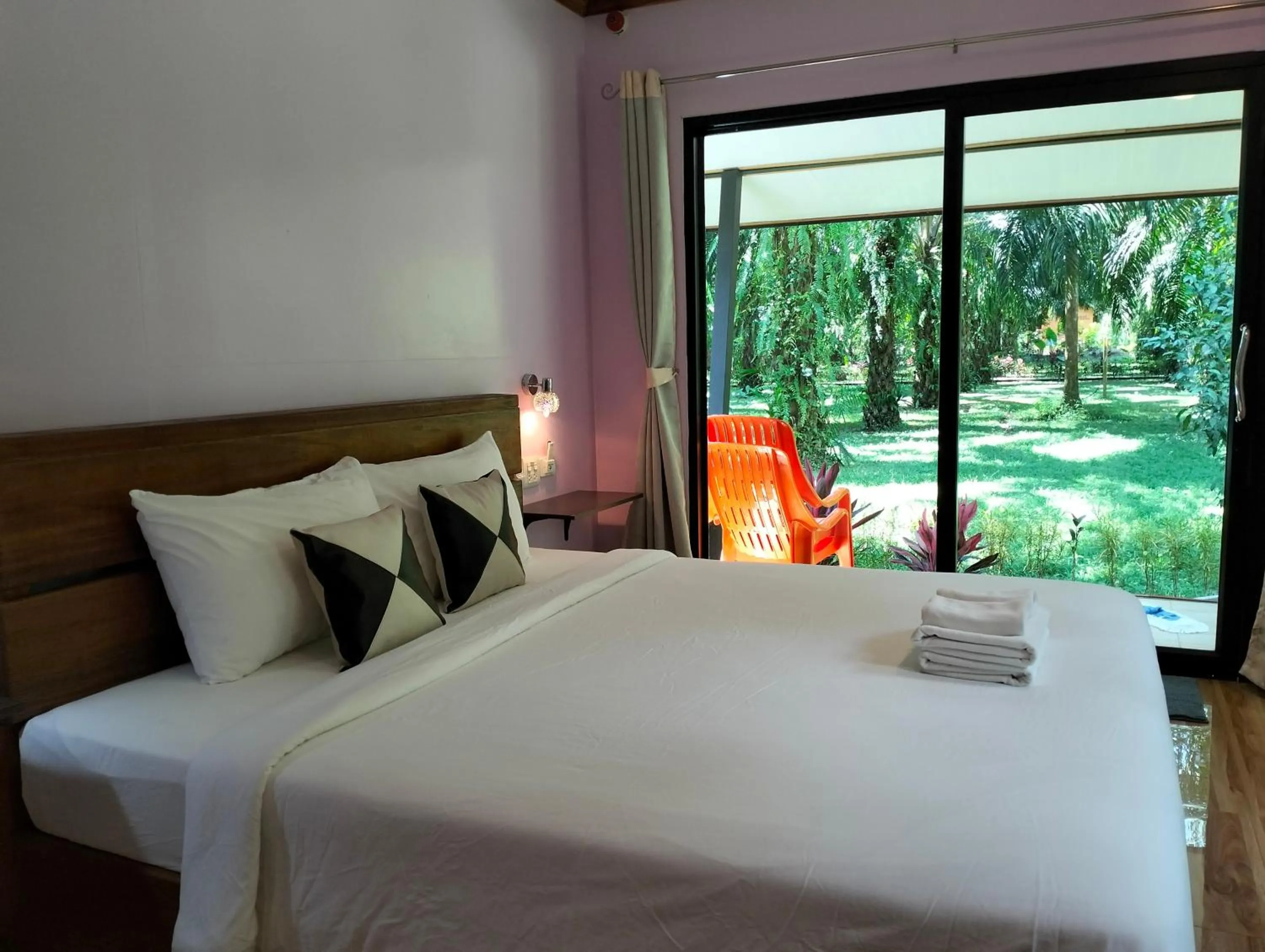 Bed in Khao Sok Palm Garden Resort