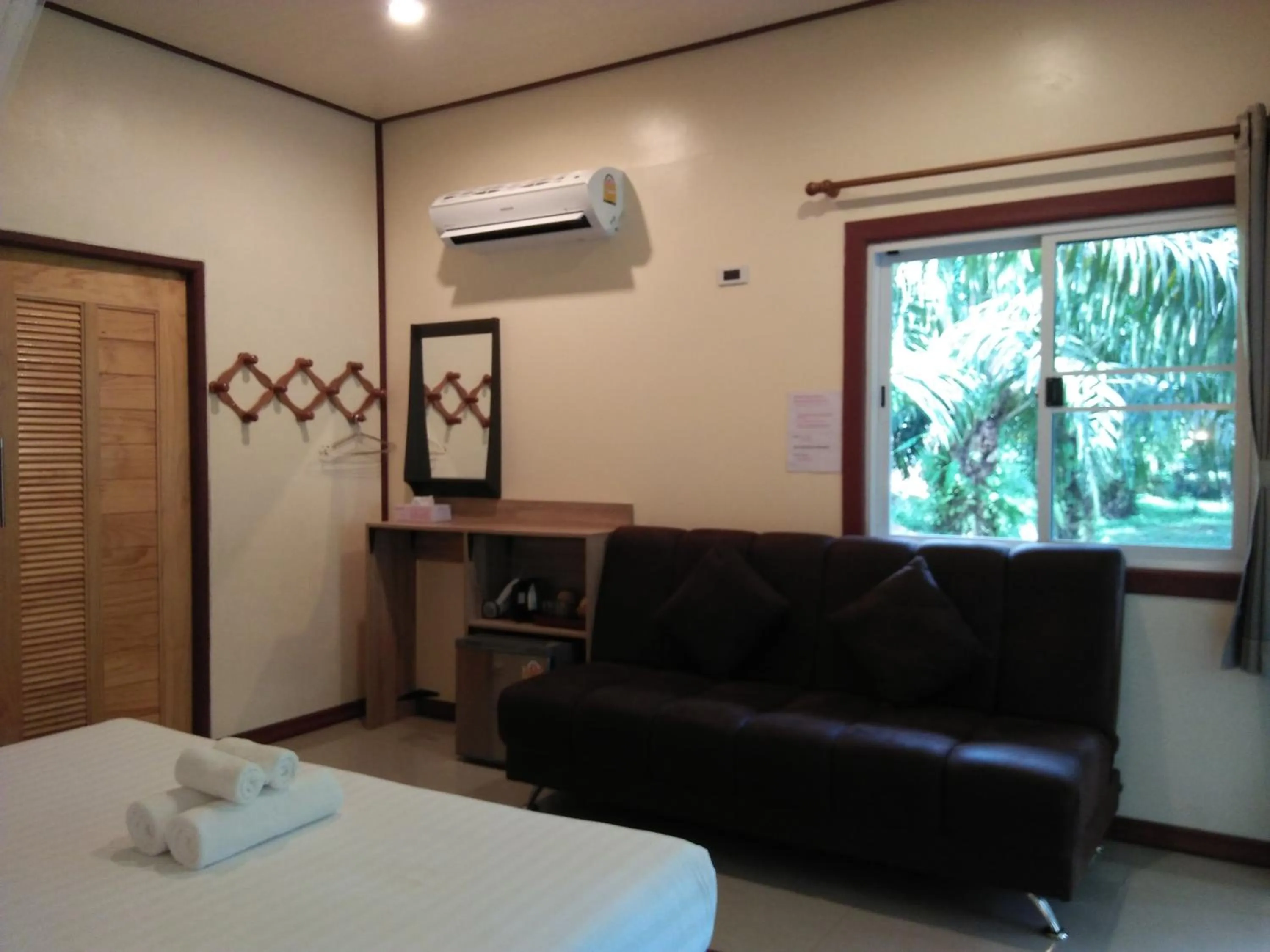 Bed in Khao Sok Palm Garden Resort