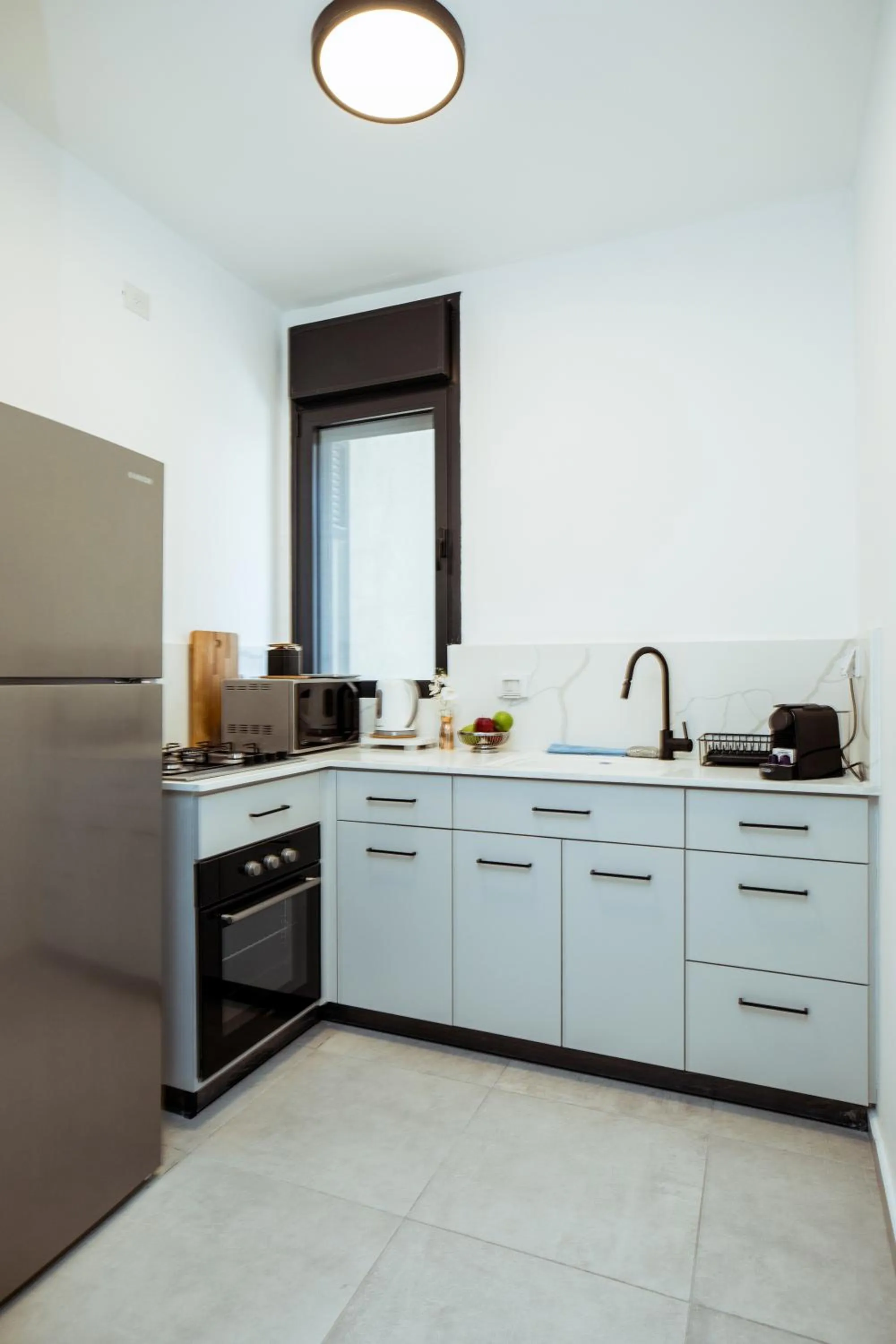 Kitchen or kitchenette in Herzl Boutique Hotel & Apartments by Domus