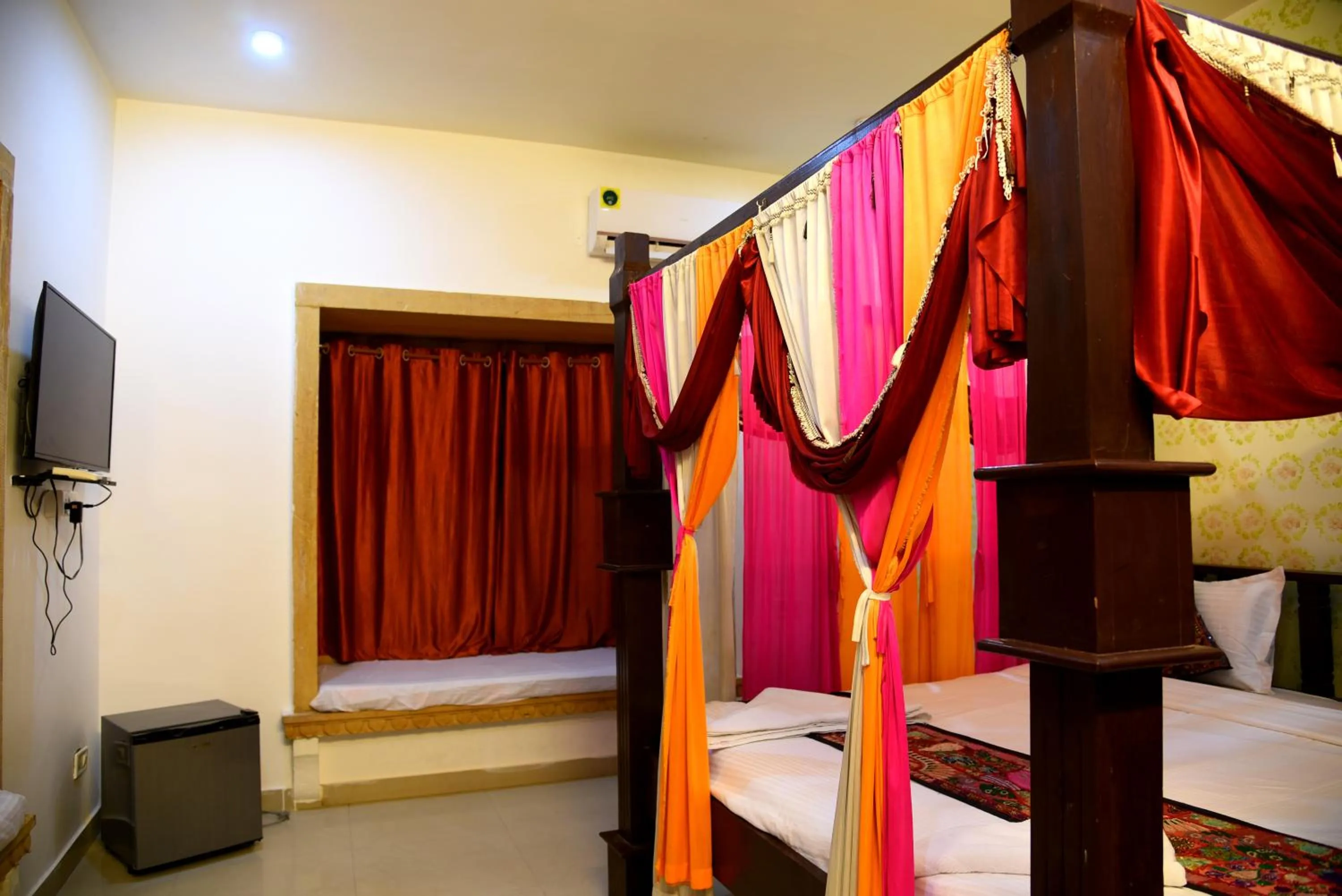 Bed in Hotel Marina Mahal with Swimming Pool