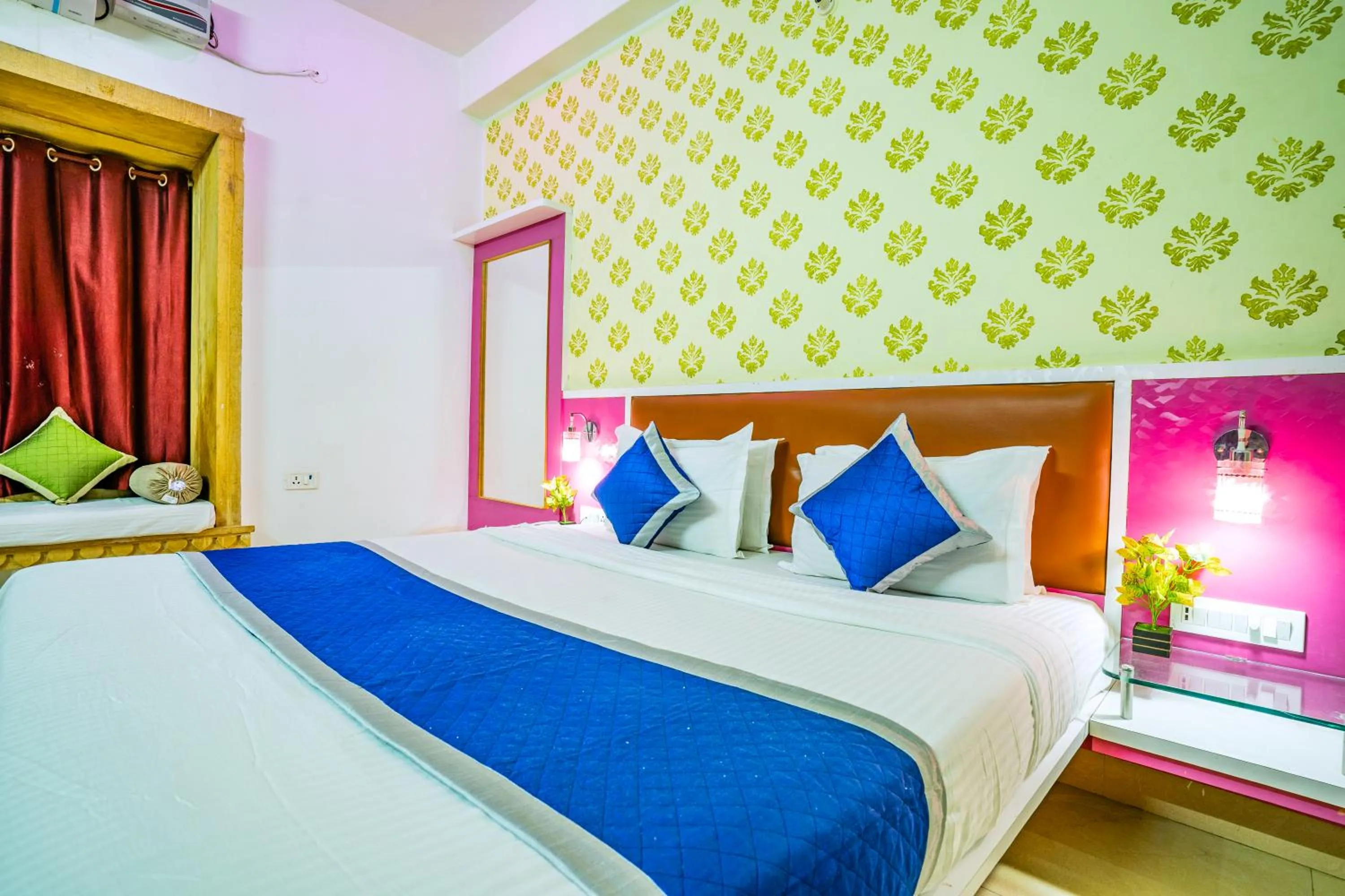 Bed in Hotel Marina Mahal with Swimming Pool