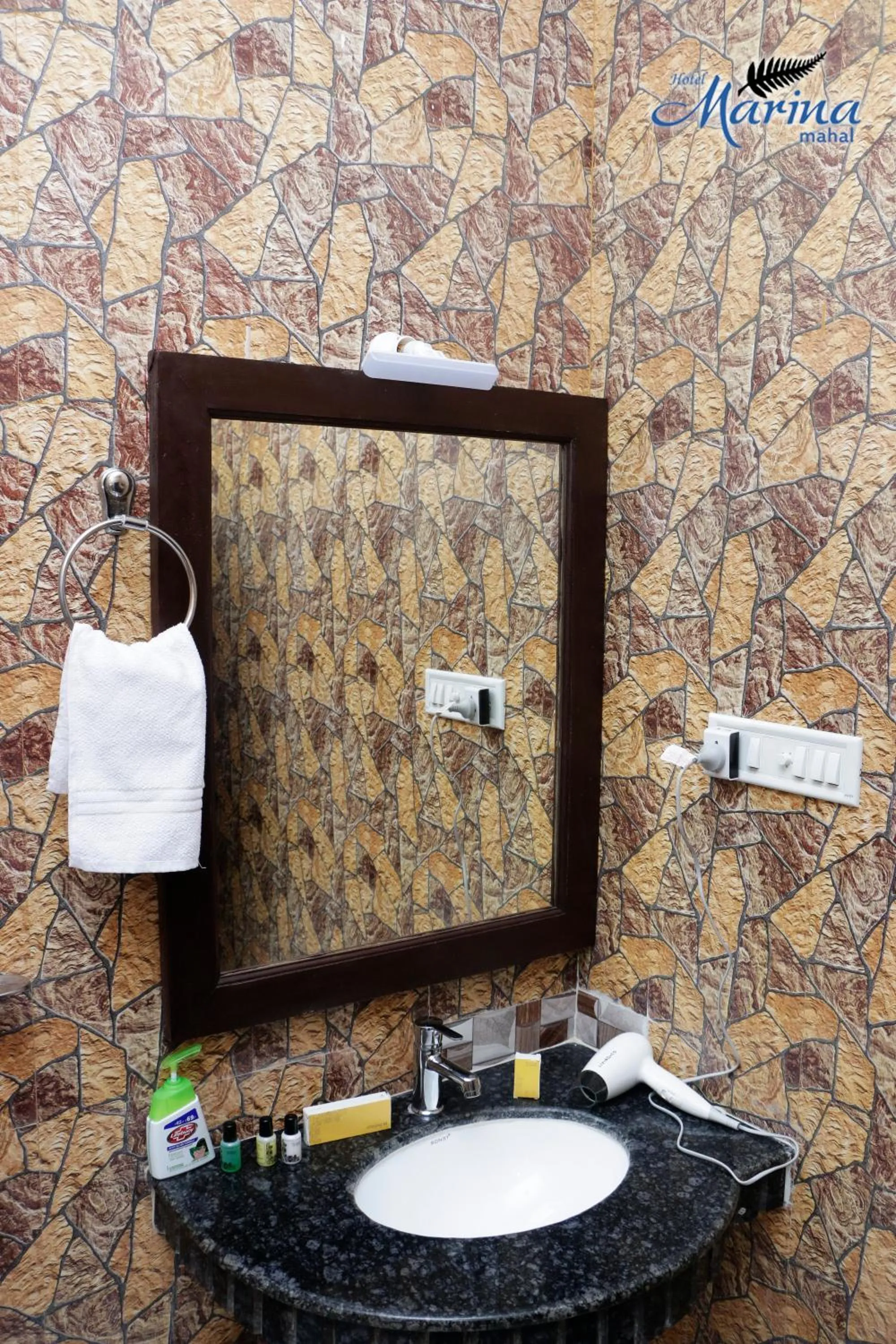 Toilet in Hotel Marina Mahal with Swimming Pool