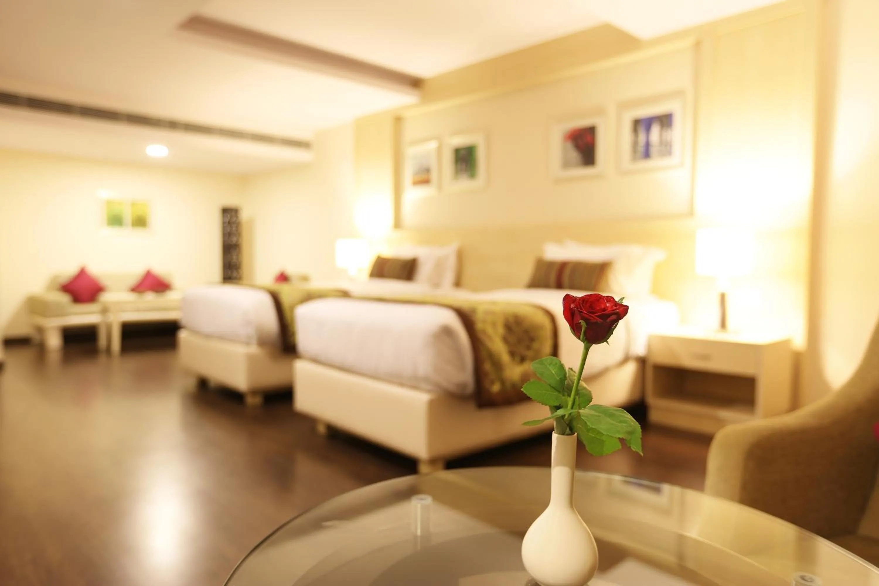 Photo of the whole room, Bed in Golden Tulip Jaipur