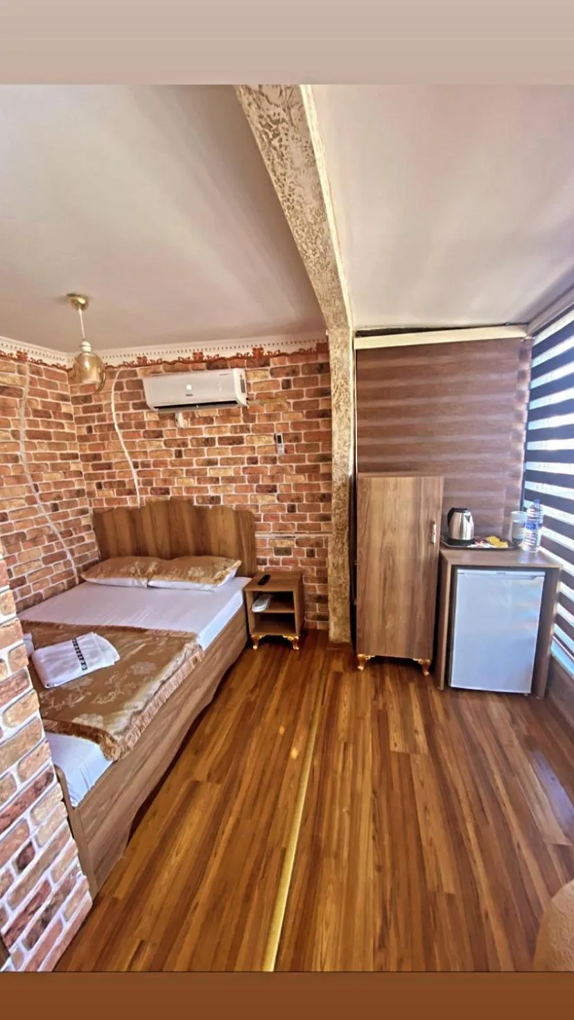 Bed in GOLDEN ARROW OLD CİTY HOTEL