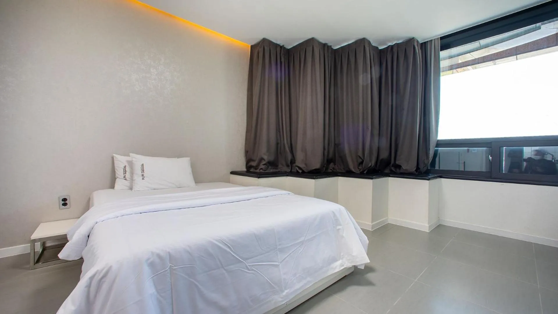 Bed in Carib Condo Hotel