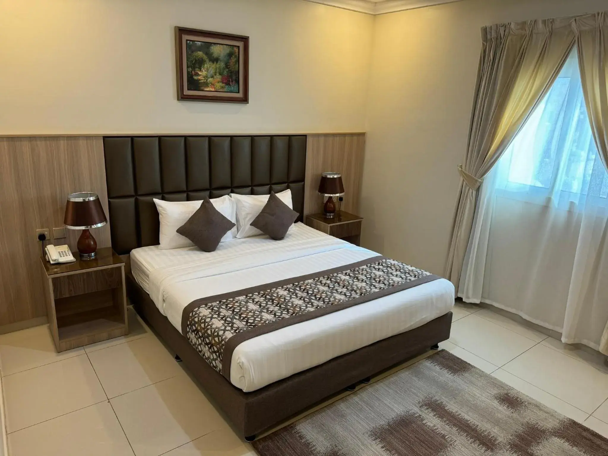 Photo of the whole room, Bed in PRIMOTEL Suites As Salamah Photo of the whole room, Bed in PRIMOTEL Suites As Salamah