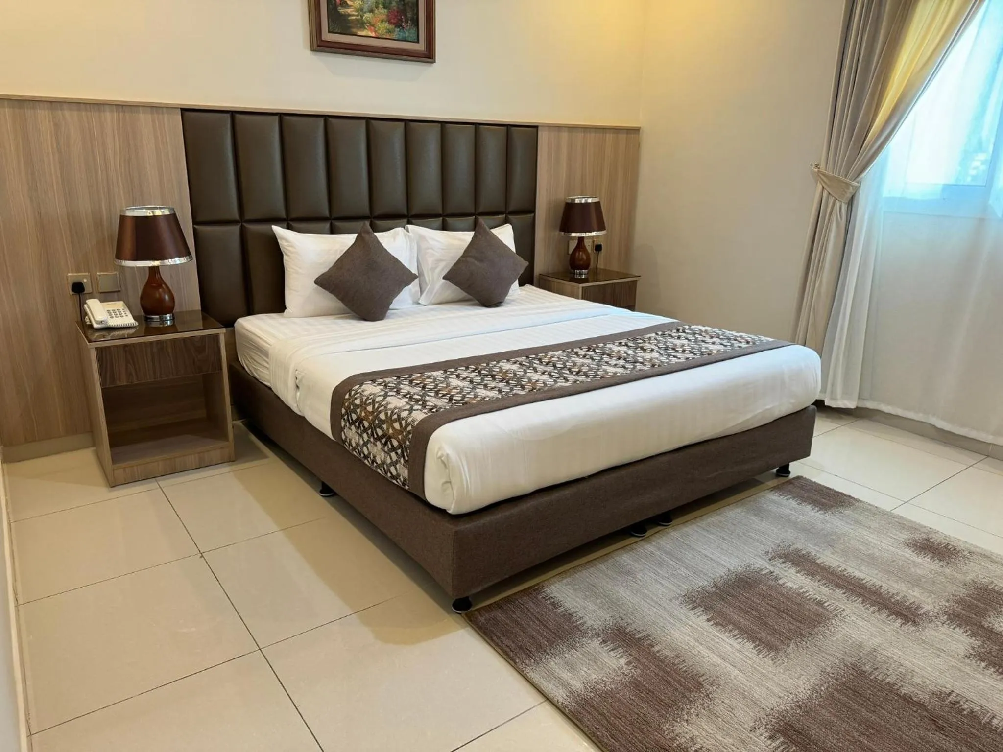 Bed in PRIMOTEL Suites As Salamah