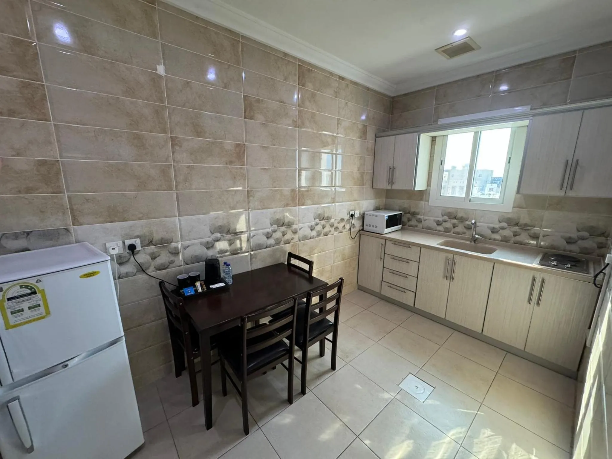 Kitchen or kitchenette in PRIMOTEL Suites As Salamah