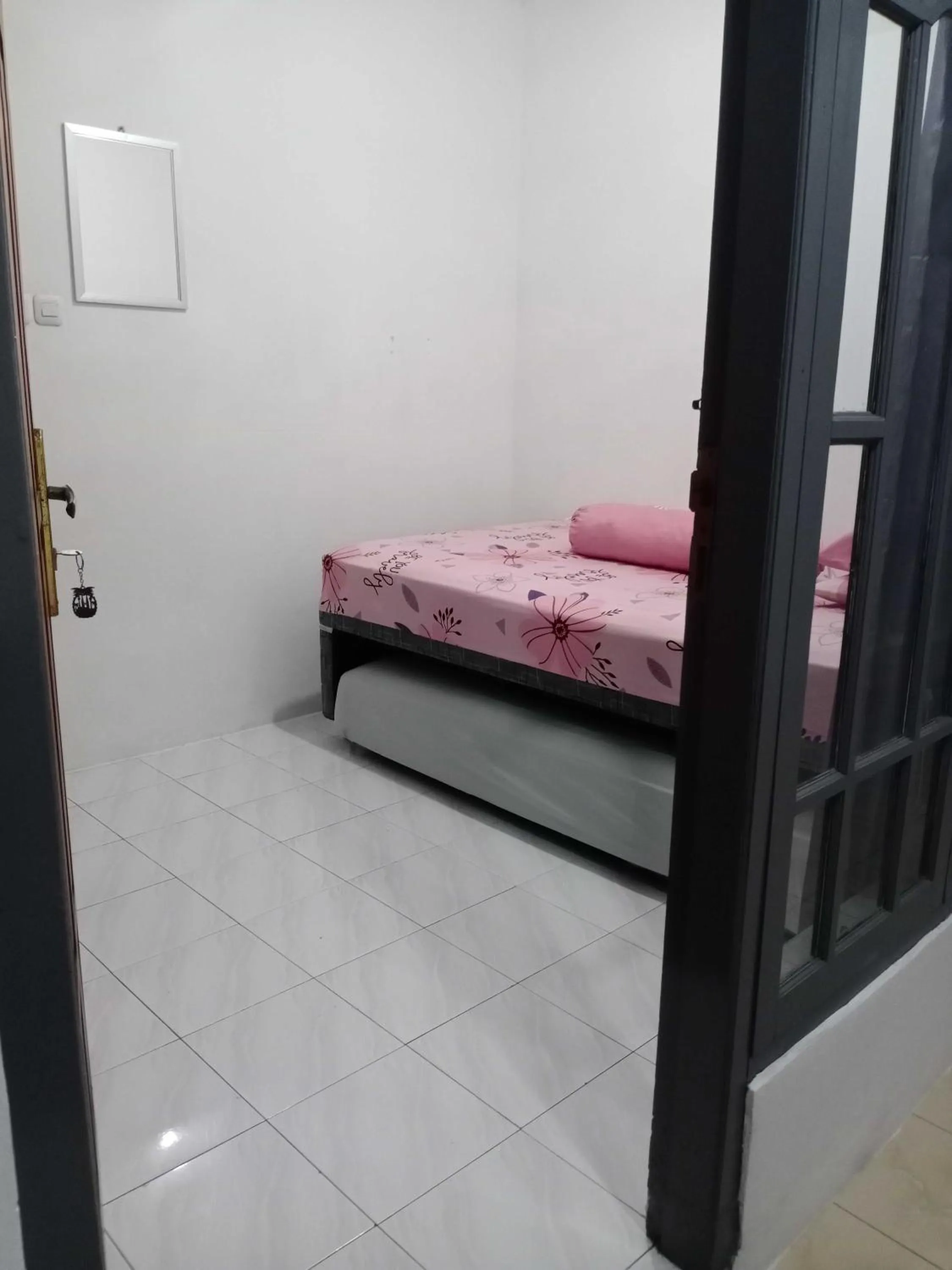 Bedroom in SPOT ON 91597 Sharie Homestay Syariah