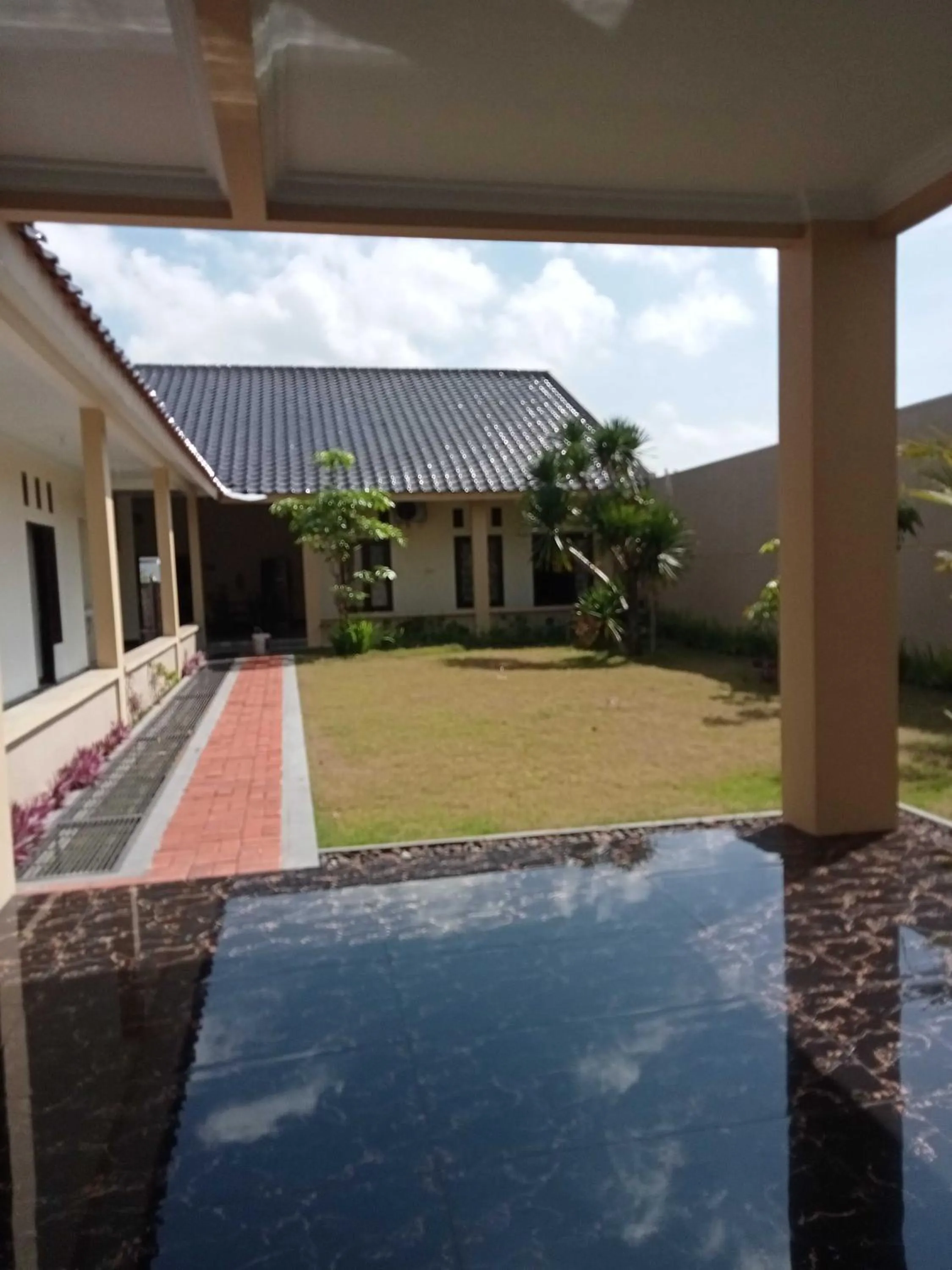 Facade/entrance in EXPRESS O 91708 Rumah Sriwijaya 12a Syariah